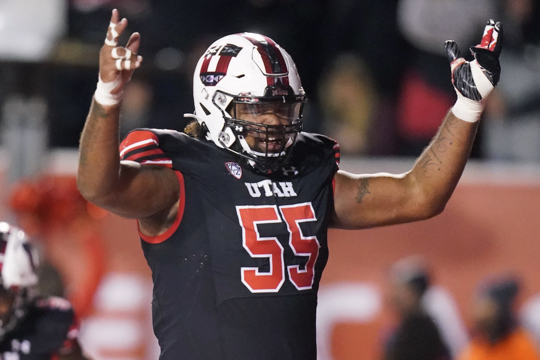 Utah offensive lineman Nick Ford (55) celebrates after TJ Pledger's touch down in the second half during an NCAA college football game against Arizona State Saturday, Oct. 16, 2021, in Salt Lake City. (AP Photo/Rick Bowmer)