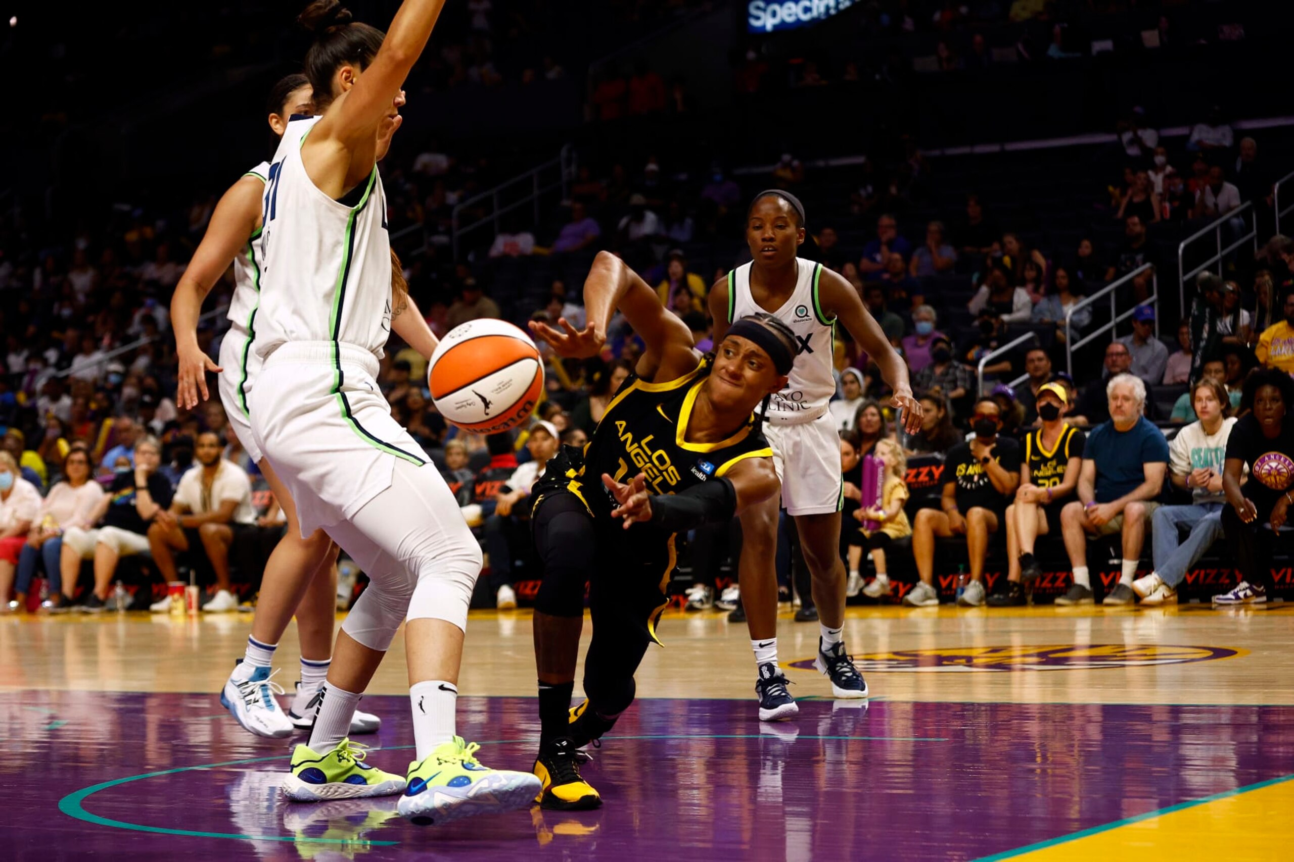 LOS ANGELES, CALIFORNIA - JULY 31: Brittney Sykes #15 of the Los Angeles Sparks passes the ball against the Minnesota Lynx in the first quarter at Crypto.com Arena on July 31, 2022 in Los Angeles, California. (Photo by Ronald Martinez/Getty Images)