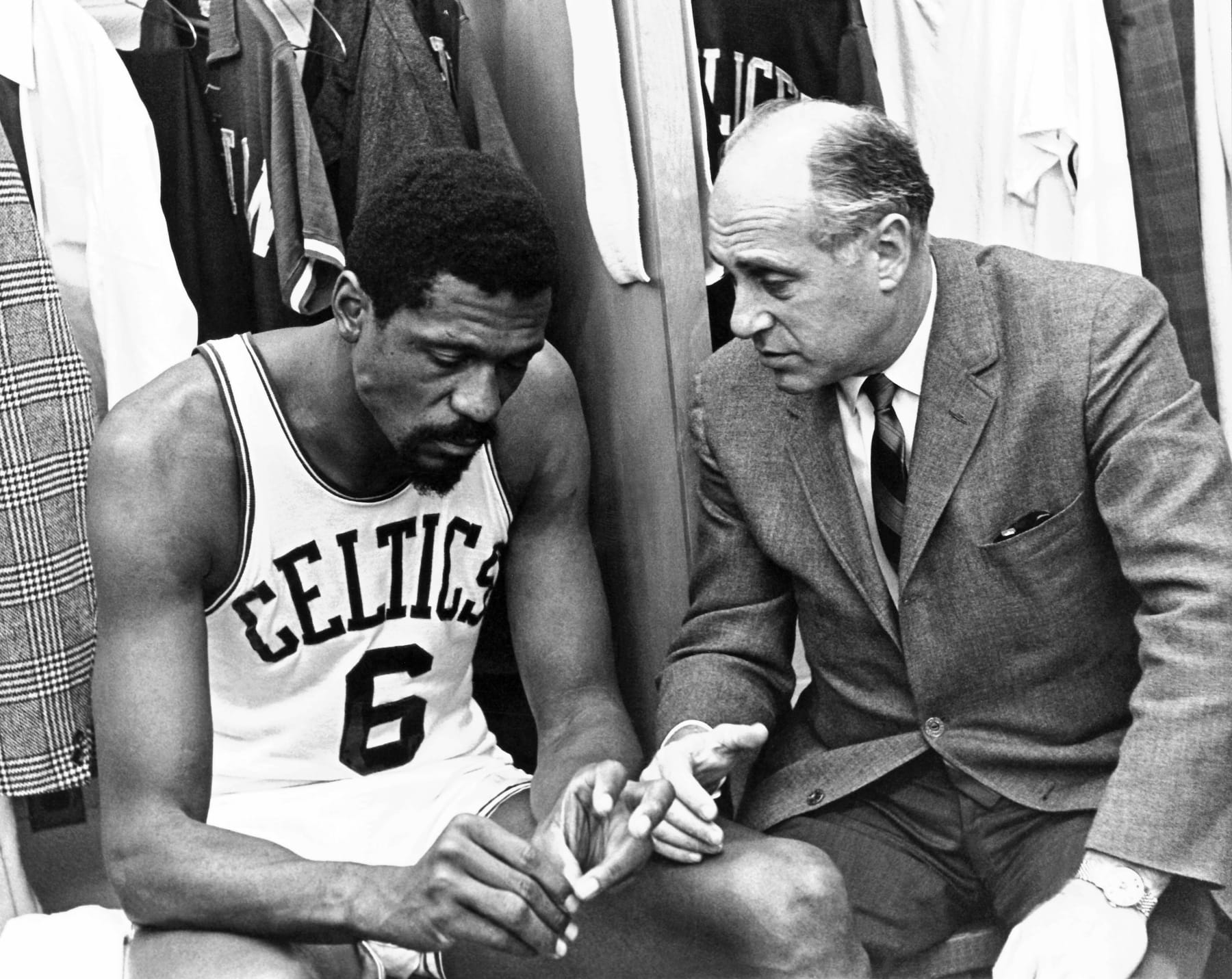 BOSTON, MI - 1970: Head coach Red Auerbach of the Boston Celtics speaks Bill Russell #6 before an NBA game circa 1970 at the Boston Garden in Boston, Massachusetts. NOTE TO USER: User expressly acknowledges and agrees that, by downloading and/or using this Photograph, user is consenting to the terms and conditions of the Getty Images License Agreement. Mandatory Copyright Notice: Copyright 1988 NBAE (Photo by Dick Raphael/NBAE via Getty Images)