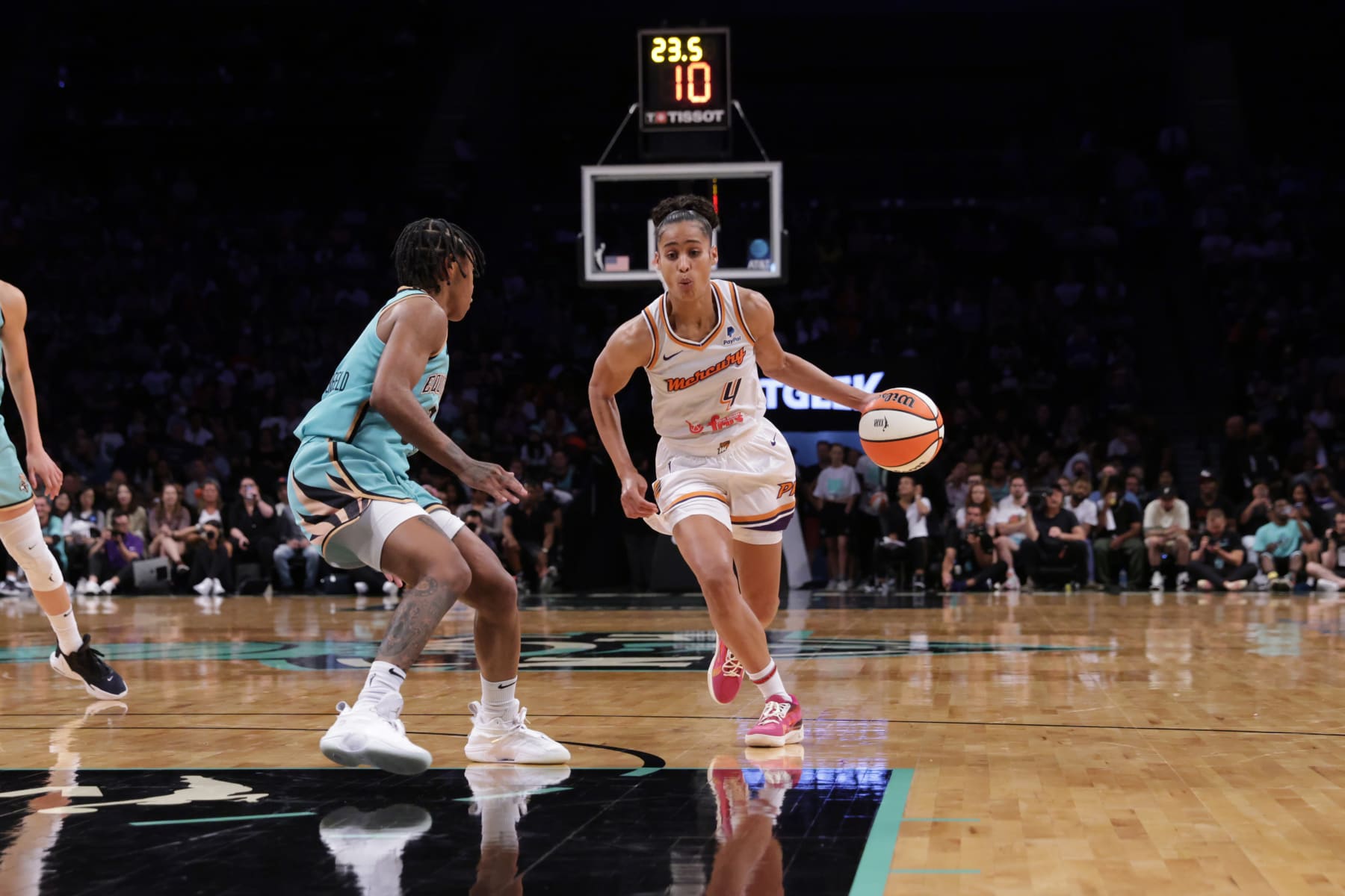 BROOKLYN, NY - JULY 31: Skylar Diggins-Smith #4 of the Phoenix Mercury dribbles the ball during the game against the New York Liberty on July 31, 2022 at the Barclays Center in Brooklyn, New York. NOTE TO USER: User expressly acknowledges and agrees that, by downloading and or using this photograph, user is consenting to the terms and conditions of the Getty Images License Agreement. Mandatory Copyright Notice: Copyright 2022 NBAE (Photo by Steven Freeman/NBAE via Getty Images)