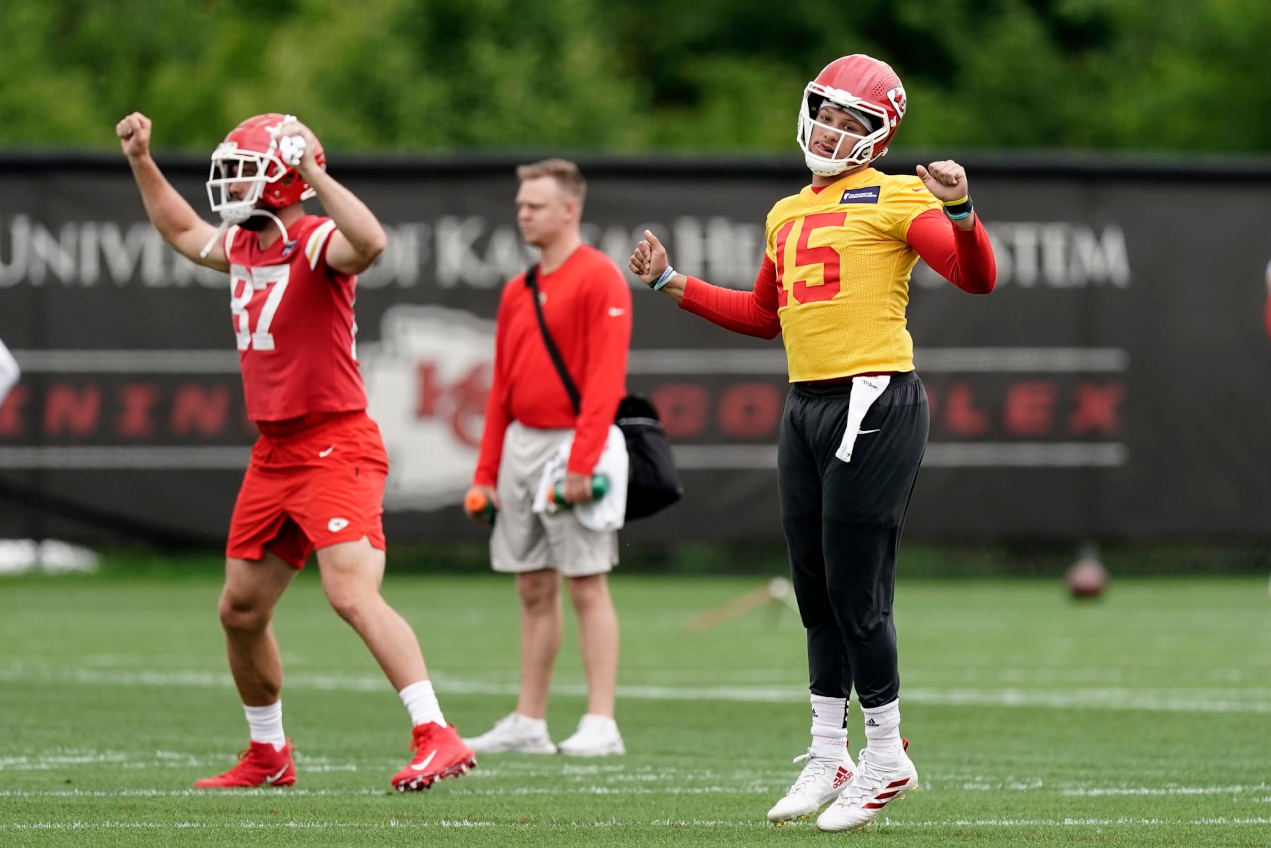 Kansas City Chiefs quarterback Patrick Mahomes (15) and tight end Travis Kelce warm up before the NFL football team's organized team activities Thursday, May 26, 2022, in Kansas City, Mo. (AP Photo/Charlie Riedel) Kansas City Chiefs quarterback Patrick Mahomes (15) and tight end Travis Kelce warm up before the NFL football team's organized team activities Thursday, May 26, 2022, in Kansas City, Mo. (AP Photo/Charlie Riedel)