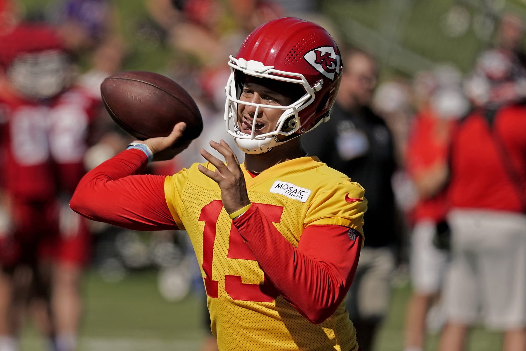 Kansas City Chiefs quarterback Patrick Mahomes throws during NFL football training camp Saturday, July 30, 2022, in St. Joseph, Mo. (AP Photo/Charlie Riedel)