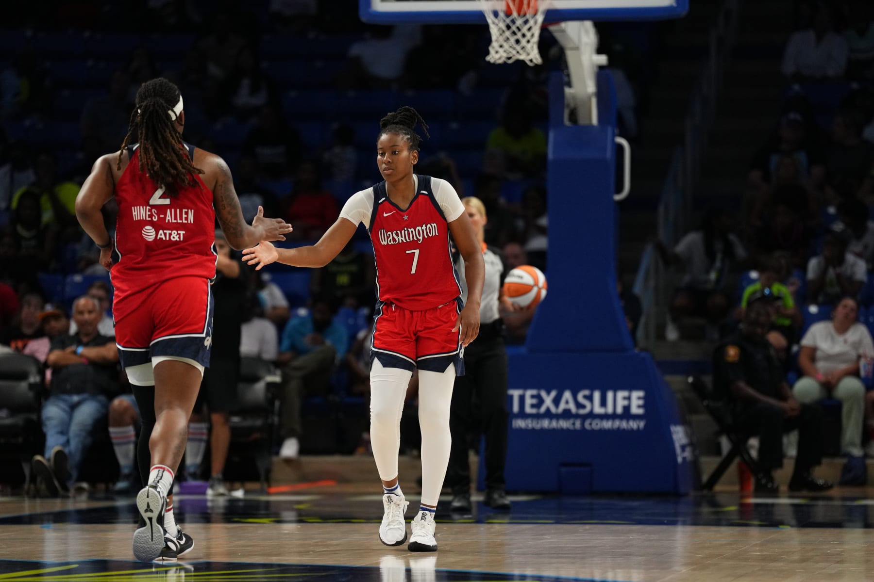 ARLINGTON, TX - JULY 28: Myisha Hines-Allen #2 of the Washington Mystics high fives Ariel Atkins #7 of the Washington Mystics during the game against the Dallas Wings on July 28, 2022 at the College Park Center in Arlington, Texas. NOTE TO USER: User expressly acknowledges and agrees that, by downloading and/or using this Photograph, user is consenting to the terms and conditions of the Getty Images License Agreement. Mandatory Copyright Notice: Copyright 2022 NBAE (Photo by Cooper Neill/NBAE via Getty Images)