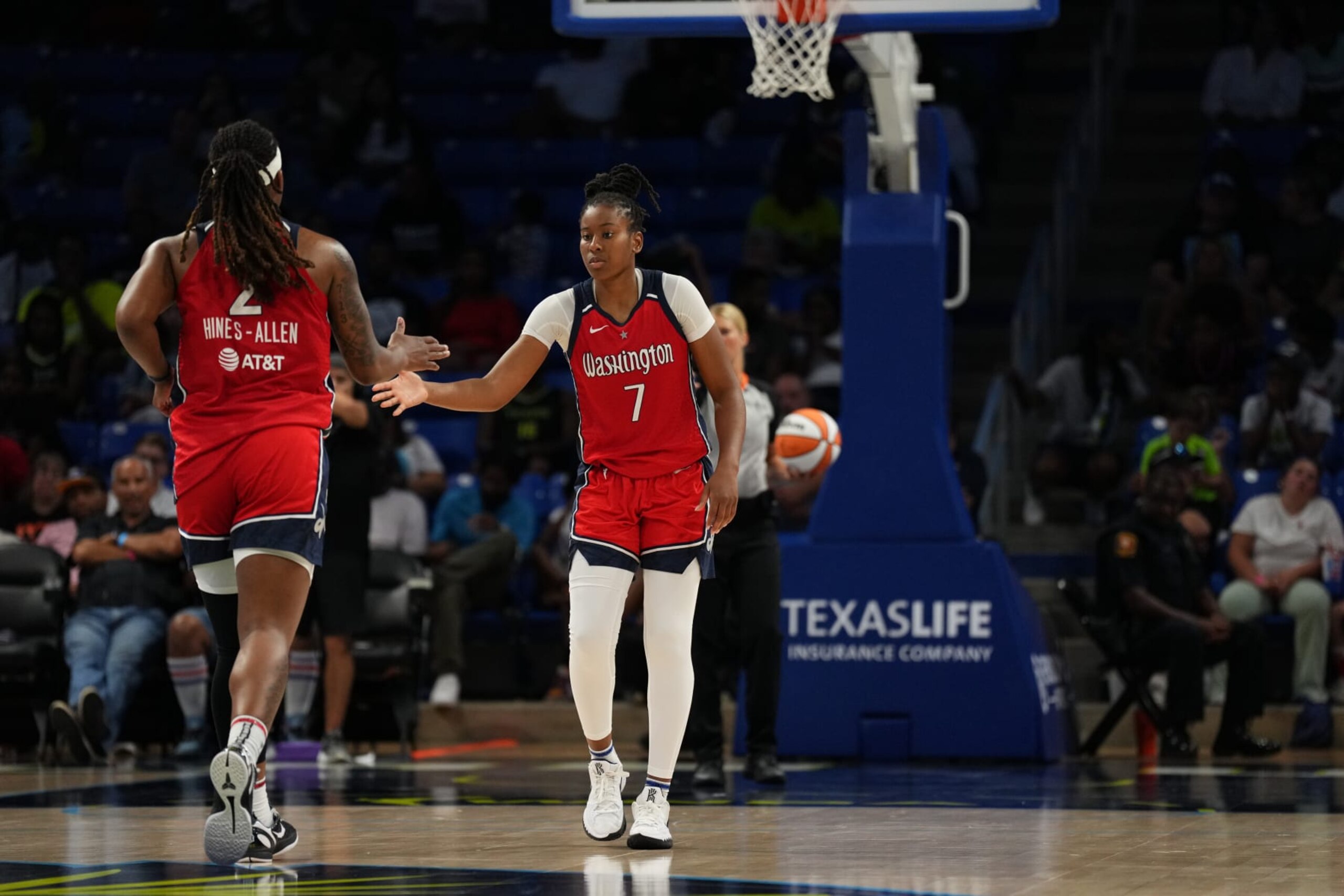 ARLINGTON, TX - JULY 28: Myisha Hines-Allen #2 of the Washington Mystics high fives Ariel Atkins #7 of the Washington Mystics during the game against the Dallas Wings on July 28, 2022 at the College Park Center in Arlington, Texas. NOTE TO USER: User expressly acknowledges and agrees that, by downloading and/or using this Photograph, user is consenting to the terms and conditions of the Getty Images License Agreement. Mandatory Copyright Notice: Copyright 2022 NBAE (Photo by Cooper Neill/NBAE via Getty Images)