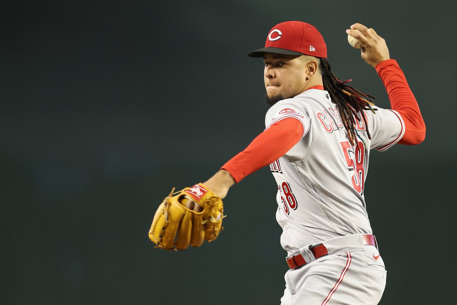PHOENIX, ARIZONA - JUNE 15: Starting pitcher Luis Castillo #58 of the Cincinnati Reds throws a warm up pitch during the fourth inning of the MLB game against the Arizona Diamondbacks at Chase Field on June 15, 2022 in Phoenix, Arizona.  The Diamondbacks defeated the Red 7-4.  (Photo by Christian Petersen/Getty Images)
