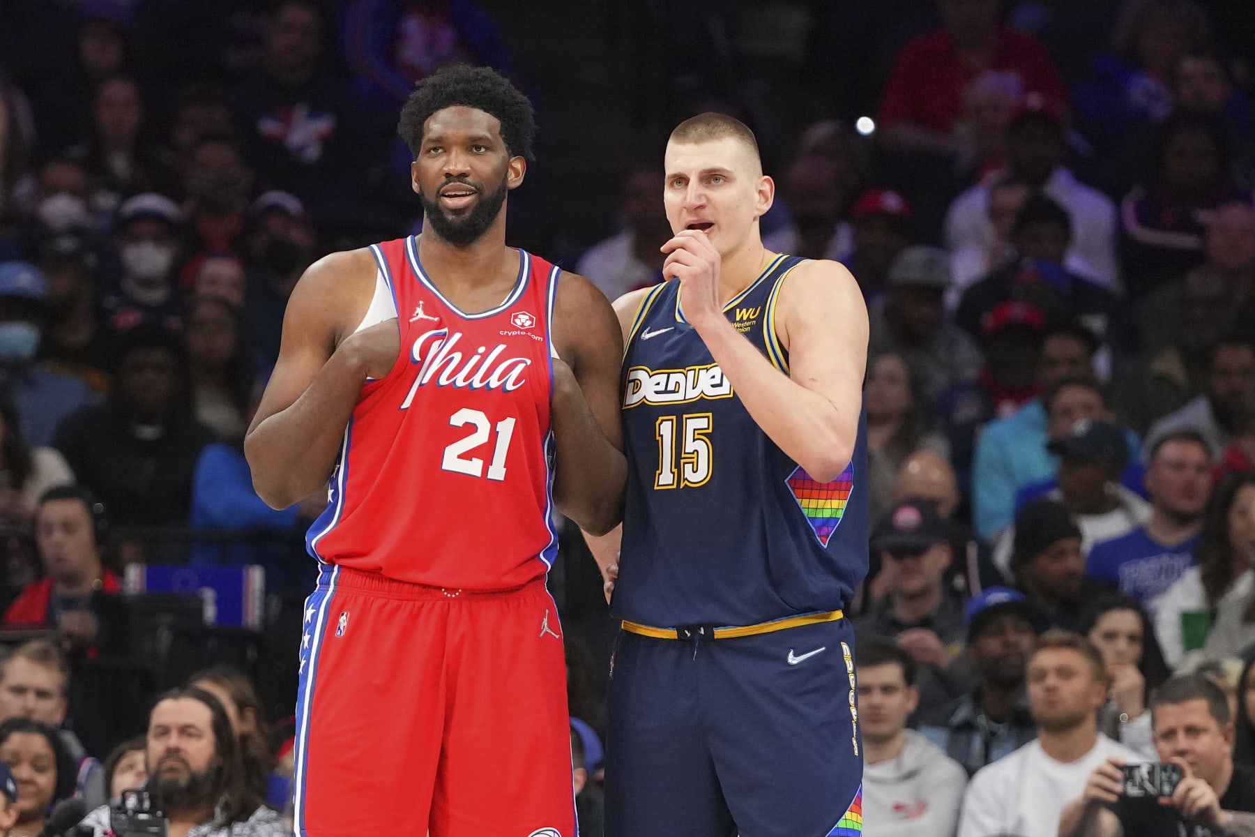 PHILADELPHIA, PA - MARCH 14: Joel Embiid #21 of the Philadelphia 76ers talks to Nikola Jokic #15 of the Denver Nuggets at the Wells Fargo Center on March 14, 2022 in Philadelphia, Pennsylvania. The Nuggets defeated the 76ers 114-110. NOTE TO USER: User expressly acknowledges and agrees that, by downloading and or using this photograph, User is consenting to the terms and conditions of the Getty Images License Agreement. (Photo by Mitchell Leff/Getty Images)