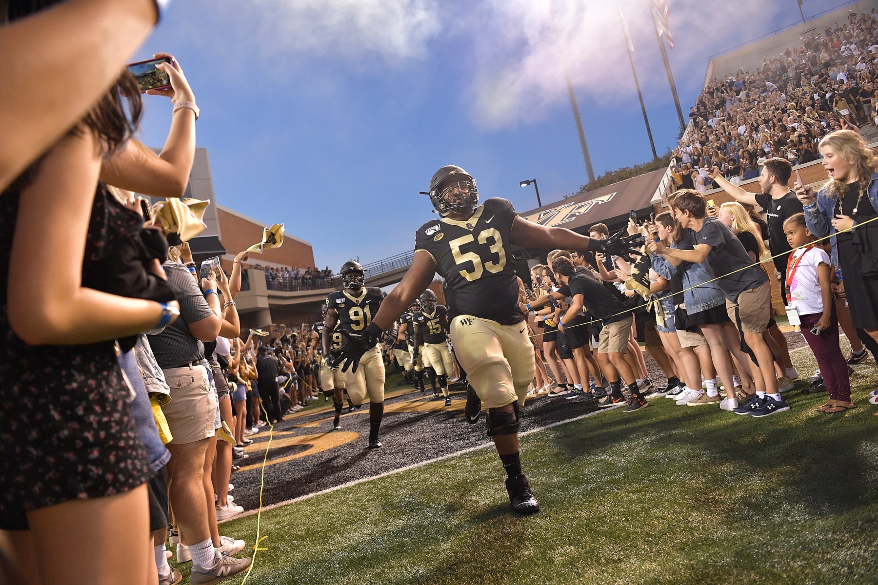 WINSTON SALEM, NORTH CAROLINA - AUGUST 30: Je'Vionte' Nash #53 of the Wake Forest Demon Deacons leads his team onto the field during their game against the Utah State Aggies at BB&T Field on August 30, 2019 in Winston Salem, North Carolina. Wake Forest won 38-35. (Photo by Grant Halverson/Getty Images)