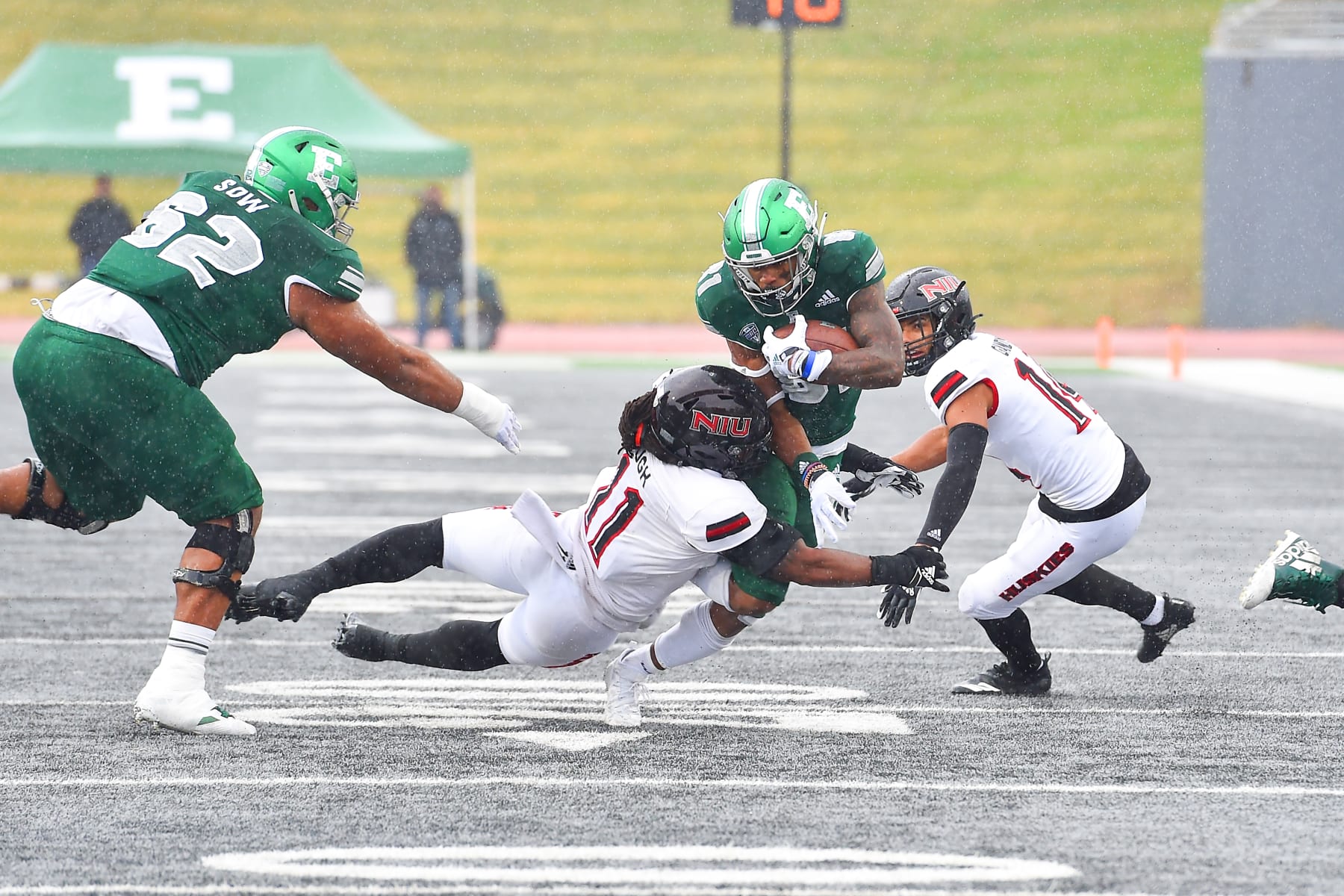 YPSILANTI, MI - DECEMBER 12: Eastern Michigan Eagles wide receiver Quian Williams (81) makes a catch and is tackled by Northern Illinois Huskies linebacker Kyle Pugh (11) during the Eastern Michigan Eagles vs Northern Illinois Huskies game on Saturday December 12, 2020 at Rynearson Stadium in Ypsilanti, MI (Photo by Steven King/Icon Sportswire via Getty Images)