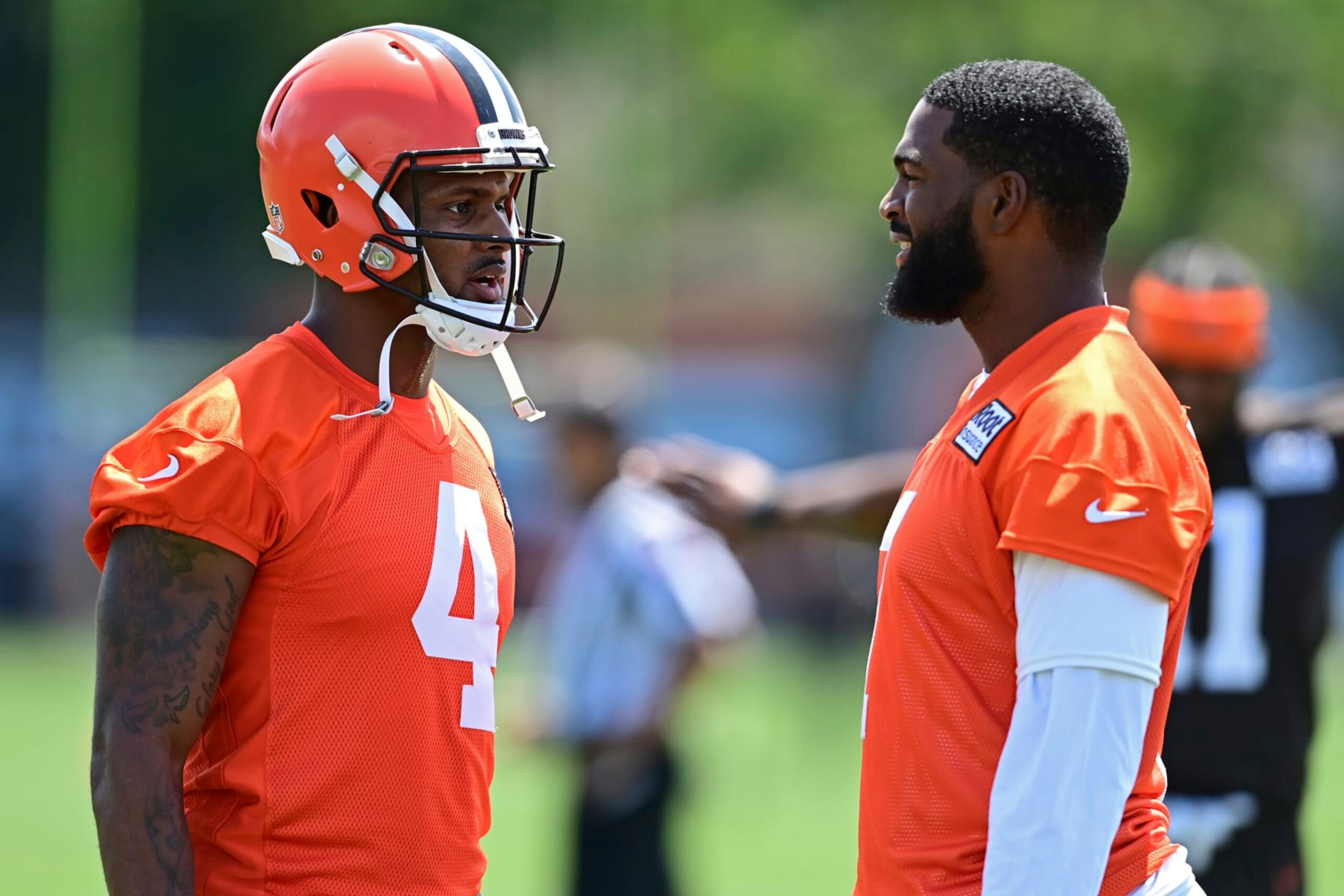 Cleveland Browns quarterbacks Deshaun Watson, left, and Jacoby Brissett talk before an NFL football practice in Berea, Ohio, Saturday, July 30, 2022. (AP Photo/David Dermer) Cleveland Browns quarterbacks Deshaun Watson, left, and Jacoby Brissett talk before an NFL football practice in Berea, Ohio, Saturday, July 30, 2022. (AP Photo/David Dermer)