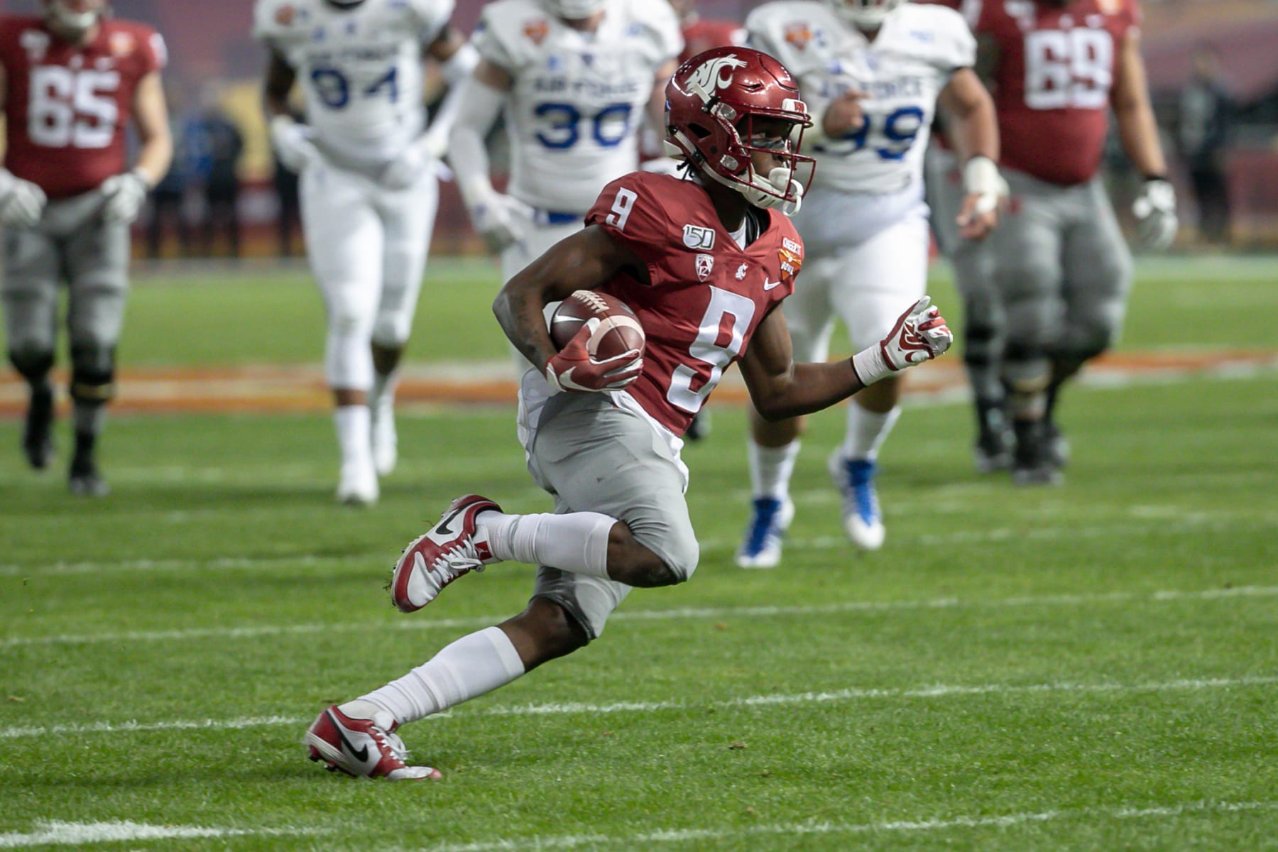 PHOENIX, AZ - DECEMBER 27:  Washington State Cougars wide receiver Renard Bell (9) runs the ball during the Cheez-It Bowl college football game between the Air Force Falcons and the Washington State Cougars on December 27, 2019 at Chase Field in Phoenix, Arizona. (Photo by Kevin Abele/Icon Sportswire via Getty Images)