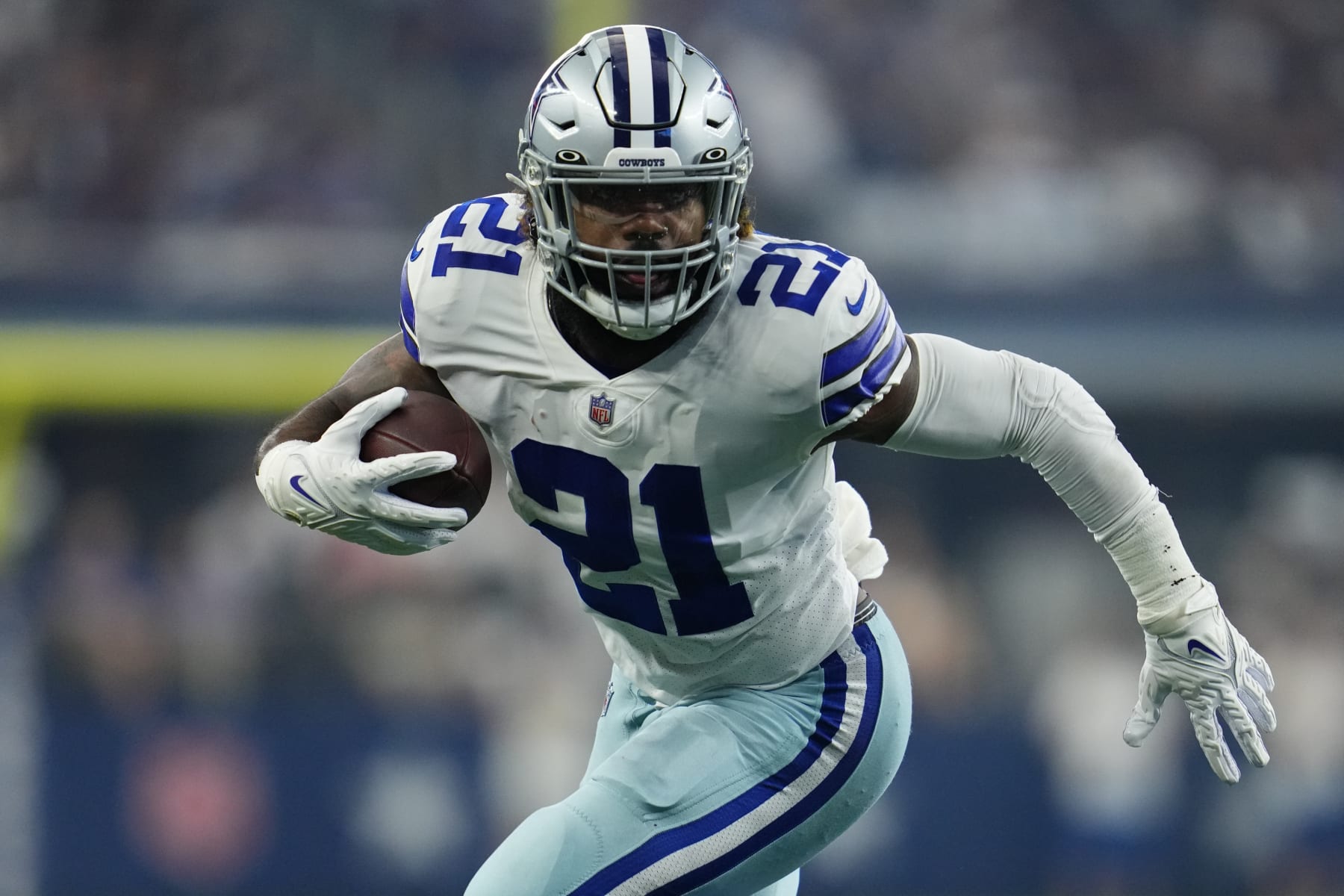 ARLINGTON, TEXAS - OCTOBER 10: Ezekiel Elliott #21 of the Dallas Cowboys runs the ball against the New York Giants during an NFL game at AT&T Stadium on October 10, 2021 in Arlington, Texas. (Photo by Cooper Neill/Getty Images)