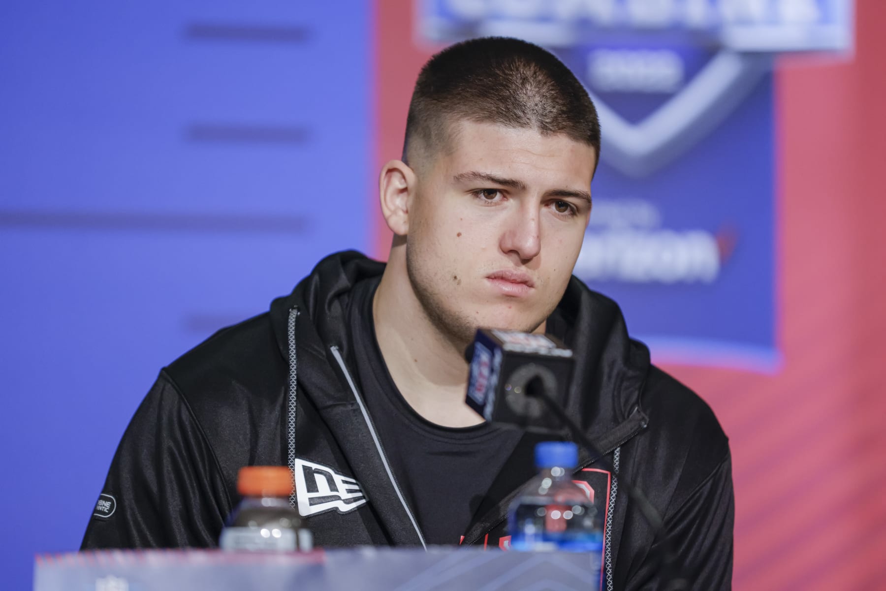 INDIANAPOLIS, IN - MAR 04: George Karlaftis #DL33 of the Purdue Boilermakers speaks to reporters during the NFL Draft Combine at the Indiana Convention Center on March 4, 2022 in Indianapolis, Indiana. (Photo by Michael Hickey/Getty Images)