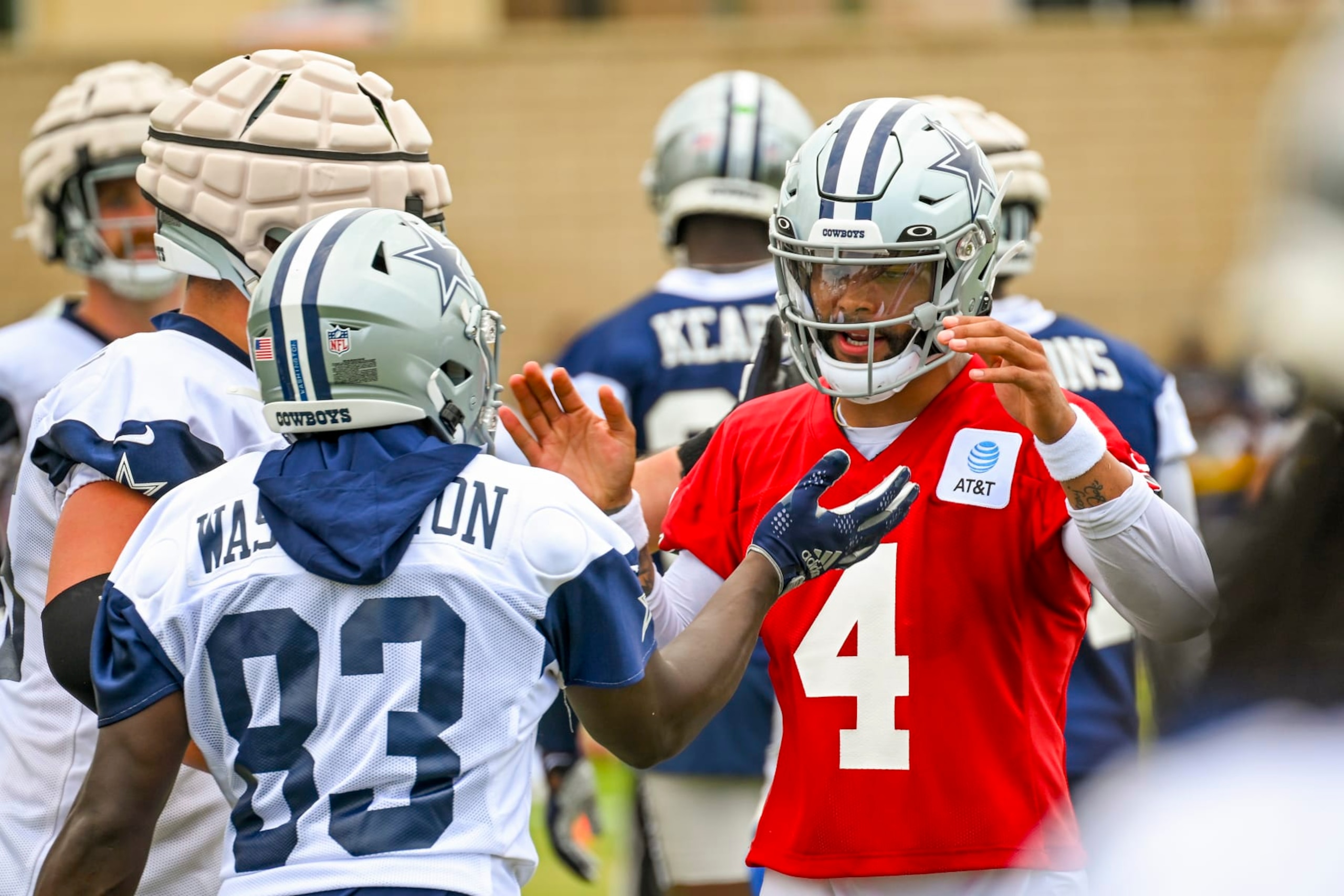 Dallas Cowboys quarterback Dak Prescott (4) celebrates a play with wide receiver James Washington (83) on opening day of NFL football training camp, Saturday, July 30, 2022, in Oxnard, Calif. (AP Photo/Gus Ruelas) Dallas Cowboys quarterback Dak Prescott (4) celebrates a play with wide receiver James Washington (83) on opening day of NFL football training camp, Saturday, July 30, 2022, in Oxnard, Calif. (AP Photo/Gus Ruelas)