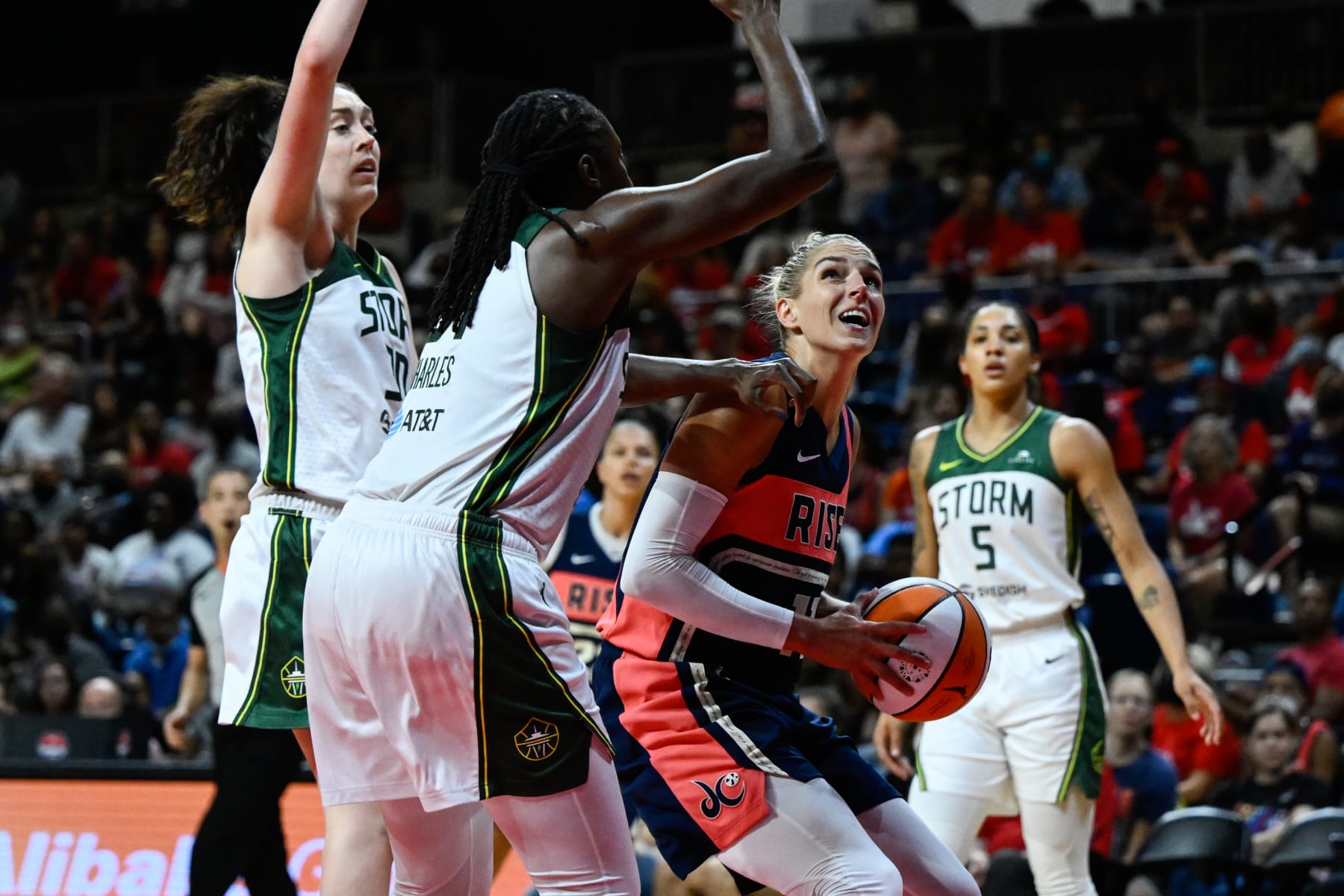 WASHINGTON, D.C. - July 31:Washington Mystics forward Elena Delle Donne looks to shoot the ball against two Seattle Storm defenders during the third quarter of a WNBA basketball game. (Terrance Williams for The Washington Post via Getty Images)