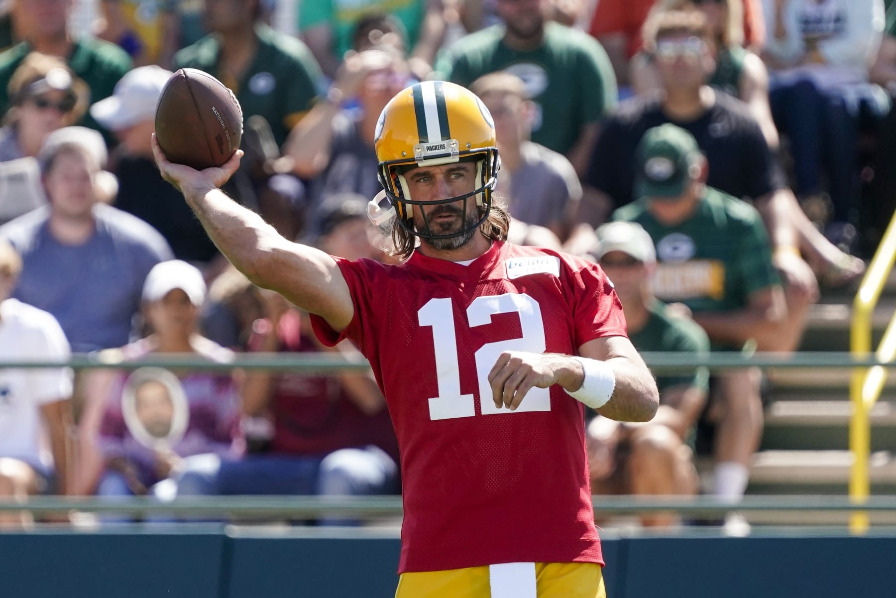 Green Bay Packers' Aaron Rodgers runs a drill at the NFL football team's practice field Saturday, July 30, 2022, in Green Bay, Wis. (AP Photo/Morry Gash)
