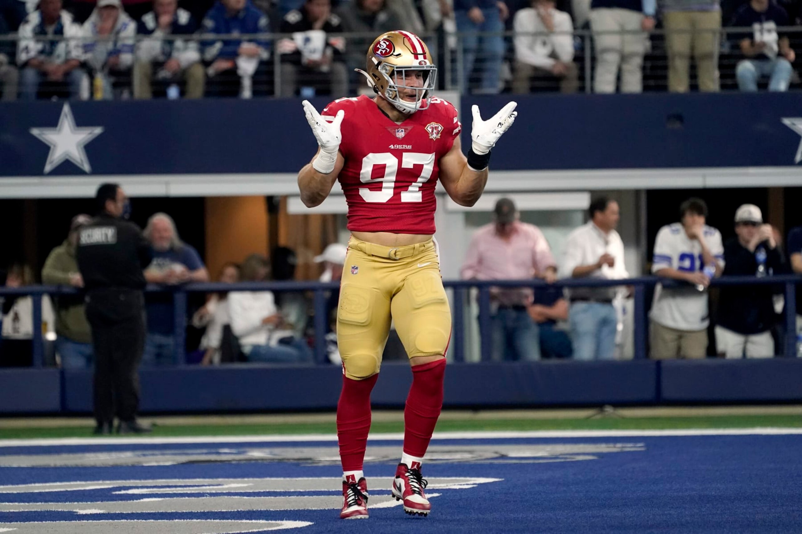 San Francisco 49ers defensive end Nick Bosa celebrates sacking Dallas Cowboys quarterback Dak Prescott during an NFL wild-card playoff football game in Arlington, Texas, Sunday, Jan. 16, 2022. (AP Photo/Tony Gutierrez)