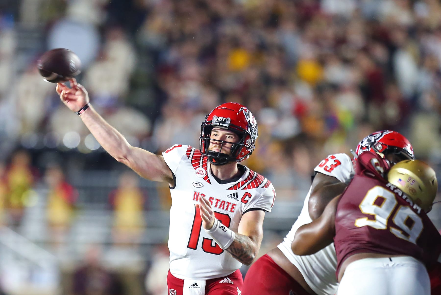 CHESTNUT HILL, MA - OCTOBER 16: NC State Wolfpack quarterback Devin Leary (13) throws a pass during a college football game between NC State Wolfpack and Boston College Eagles on October 16, 2021, at Alumni Stadium in Chestnut Hill, MA. (Photo by M. Anthony Nesmith/Icon Sportswire via Getty Images)