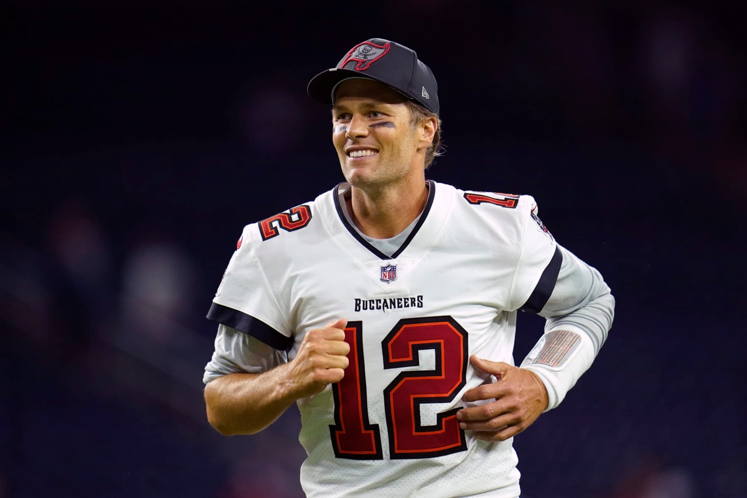 FILE -Tampa Bay Buccaneers quarterback Tom Brady (12) smiles as he runs off the field after an NFL preseason football game against the Houston Texans, Saturday, Aug. 28, 2021, in Houston. Tom Brady will be on the hot seat โ this time during a Netflix roast. Netflix announced Tuesday, May 17, 2022, the seven-time Super Bowl champion will be featured first in a series of upcoming specials called โGreatest Roasts of All Time: GROAT.โ Brady is the executive producer of the series, with his roast set to tape in 2023. (AP Photo/Matt Patterson, File) FILE -Tampa Bay Buccaneers quarterback Tom Brady (12) smiles as he runs off the field after an NFL preseason football game against the Houston Texans, Saturday, Aug. 28, 2021, in Houston. Tom Brady will be on the hot seat โ this time during a Netflix roast. Netflix announced Tuesday, May 17, 2022, the seven-time Super Bowl champion will be featured first in a series of upcoming specials called โGreatest Roasts of All Time: GROAT.โ Brady is the executive producer of the series, with his roast set to tape in 2023. (AP Photo/Matt Patterson, File)