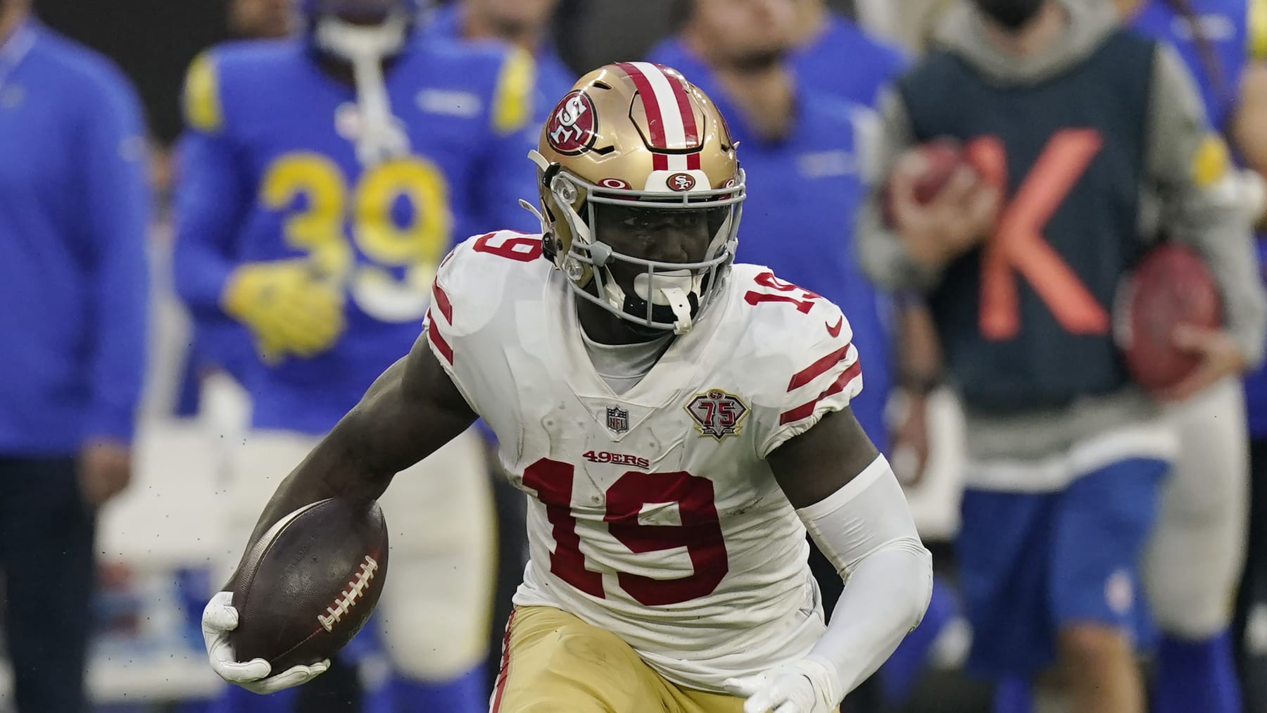 San Francisco 49ers wide receiver Deebo Samuel (19) runs the ball during an NFL football game against the Los Angeles Rams Sunday, Jan. 9, 2022, in Inglewood, Calif. (AP Photo/Mark J. Terrill)