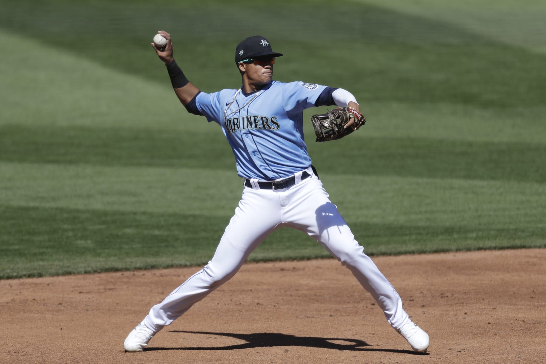 Seattle Mariners shortstop Noelvi Marte throws to first during an intrasquad baseball game Tuesday, July 14, 2020, in Seattle. (AP Photo/Elaine Thompson)