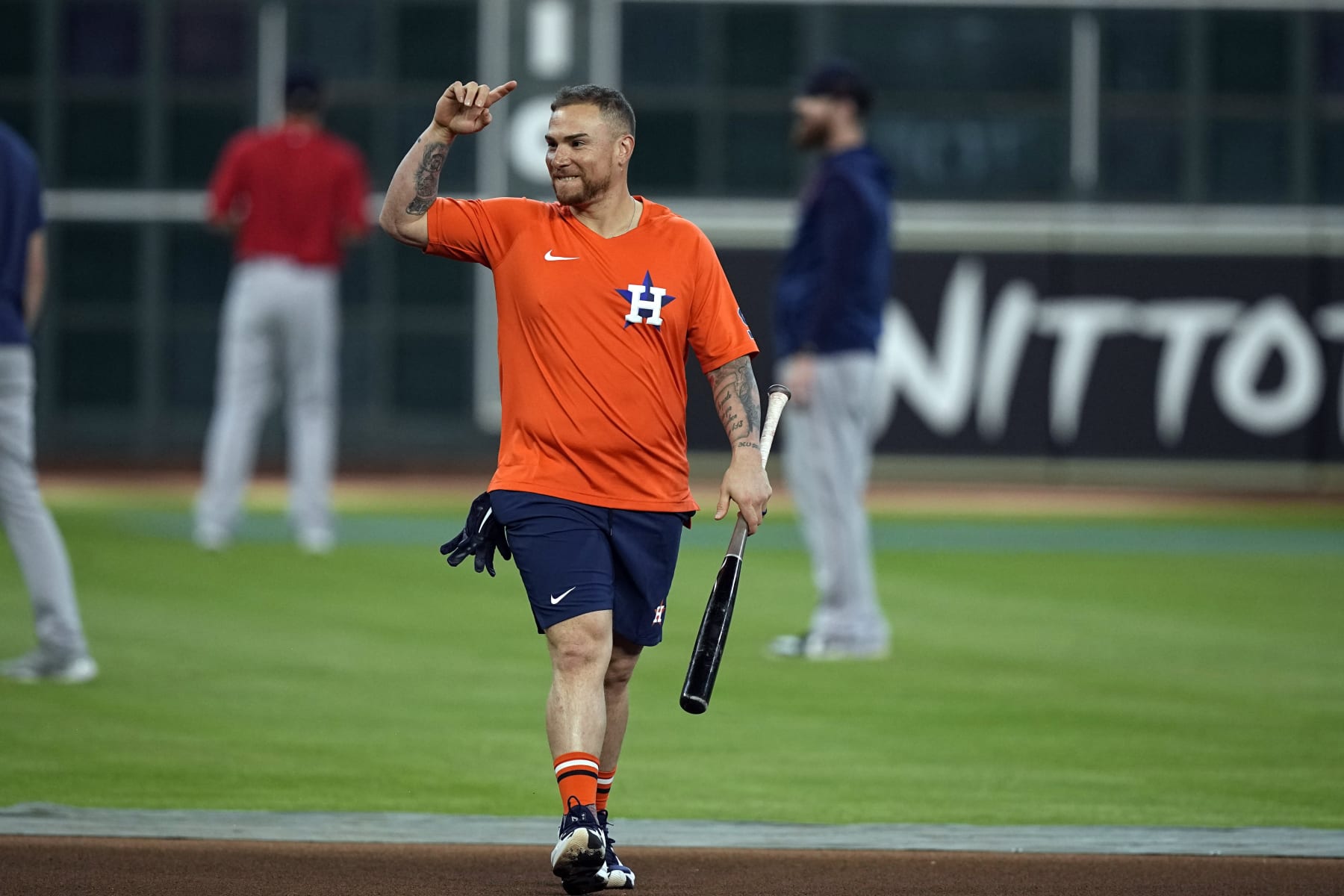 Houston Astros' Christian Vazquez waves to former teammates before a baseball game against the Boston Red Sox Tuesday, Aug. 2, 2022, in Houston. Vazquez was traded from the Red Sox to the Astros Monday. (AP Photo/David J. Phillip)