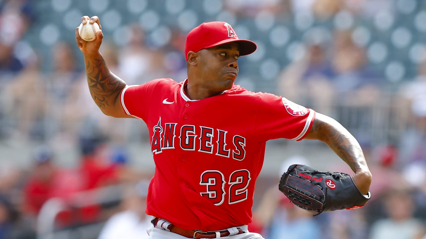ATLANTA, GA - JULY 24: Raisel Iglesias #32 of the Los Angeles Angels pitches during the ninth inning against the Atlanta Braves at Truist Park on July 24, 2022 in Atlanta, Georgia. (Photo by Todd Kirkland/Getty Images)
