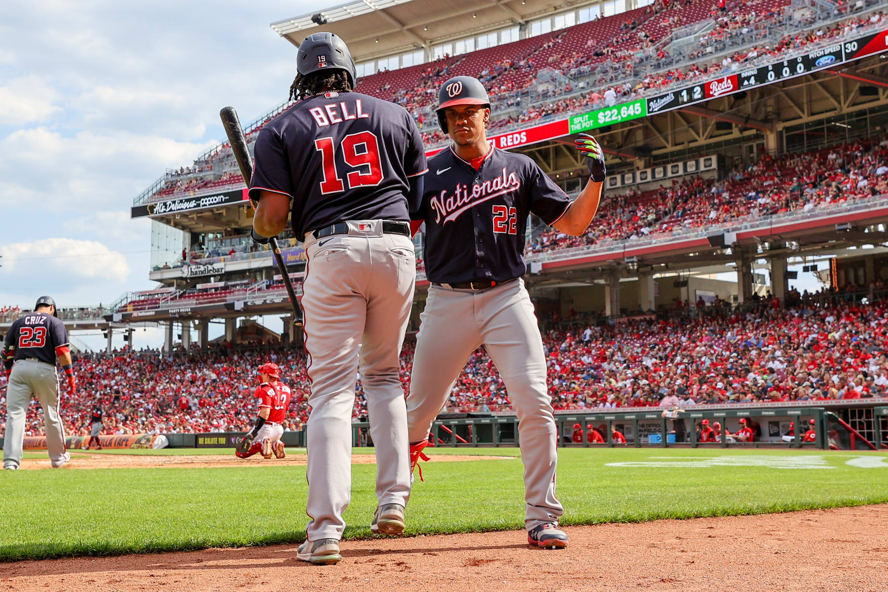CINCINNATI, OHIO - JUNE 04: Josh Bell #19 and Juan Soto #22 of the Washington Nationals celebrate after Soto hit a home run in the fourth inning against the Cincinnati Reds at Great American Ball Park on June 04, 2022 in Cincinnati, Ohio. (Photo by Dylan Buell/Getty Images)