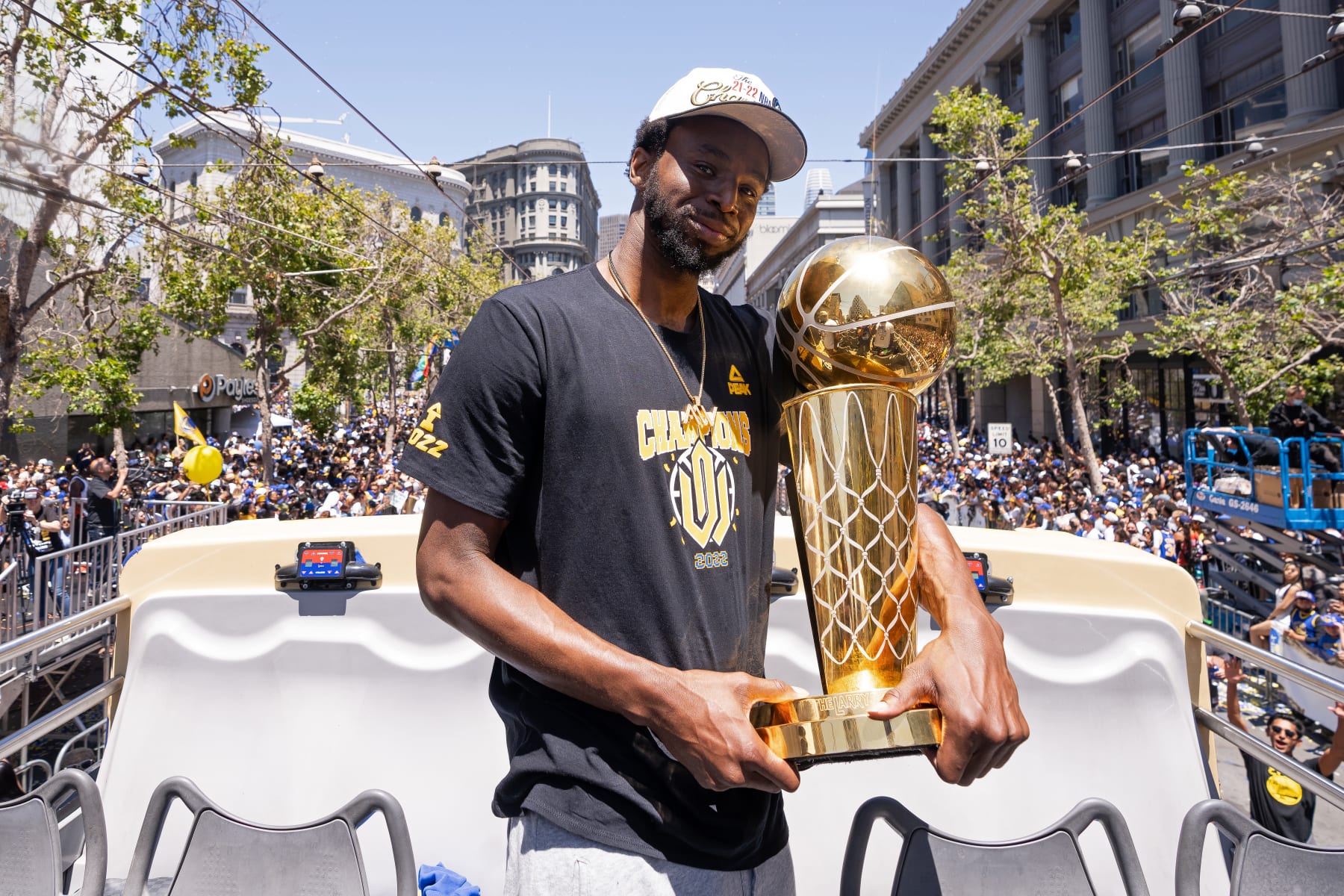 SAN FRANCISCO, CA - JUNE 20: Andrew Wiggins #22 of the Golden State Warriors holds the Larry O'Brien Championship Trophy during their 2022 Victory Parade & Rally on June 20, 2022 at Chase Center in San Francisco, California. NOTE TO USER: User expressly acknowledges and agrees that, by downloading and or using this photograph, user is consenting to the terms and conditions of Getty Images License Agreement. Mandatory Copyright Notice: Copyright 2022 NBAE (Photo by Josh Leung/NBAE via Getty Images)