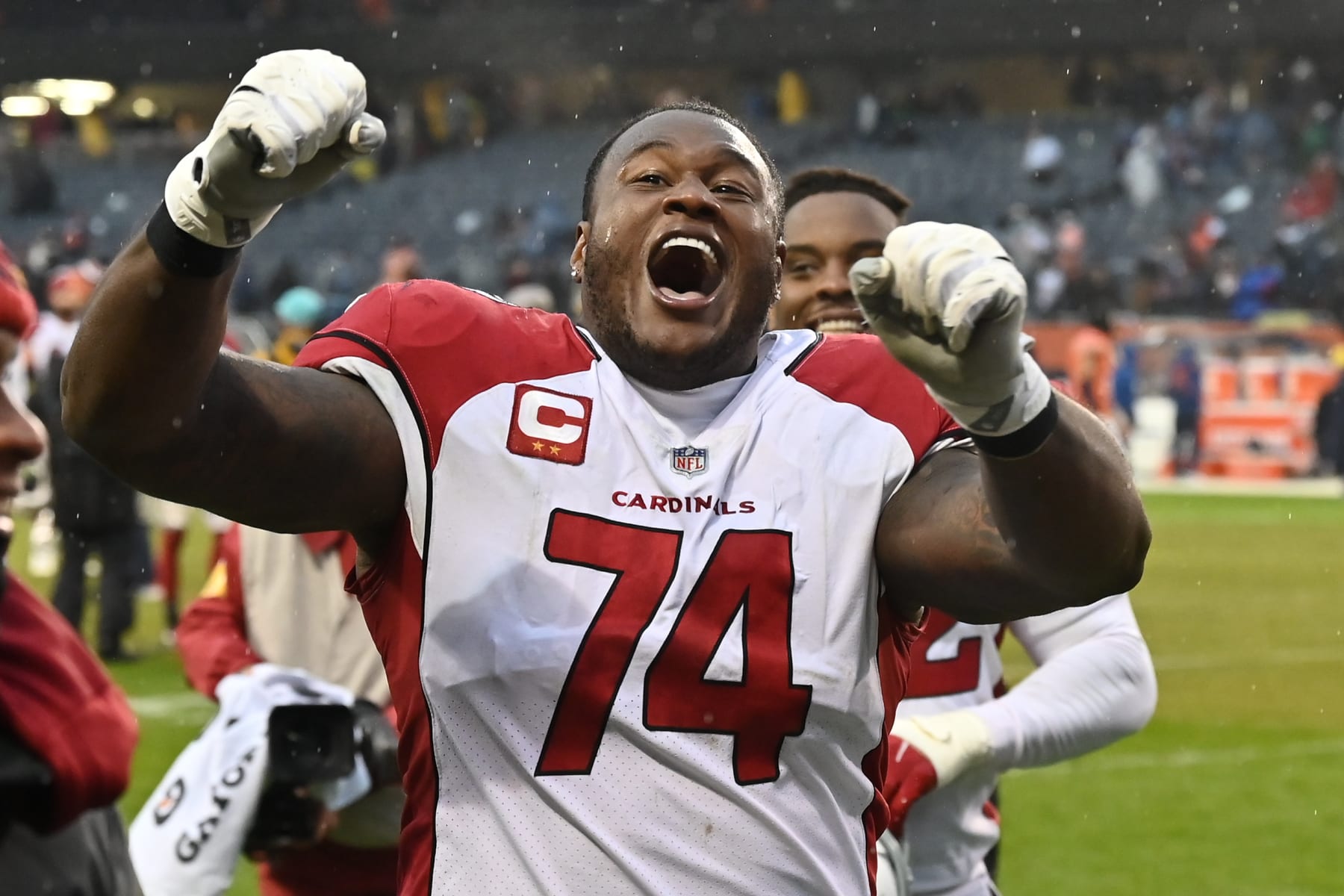 CHICAGO, ILLINOIS - DECEMBER 05:  D.J. Humphries #74 of the Arizona Cardinals celebrates with fans after Arizona defeated the Chicago Bears 33-22 at Soldier Field on December 05, 2021 in Chicago, Illinois.  (Photo by Jamie Sabau/Getty Images)