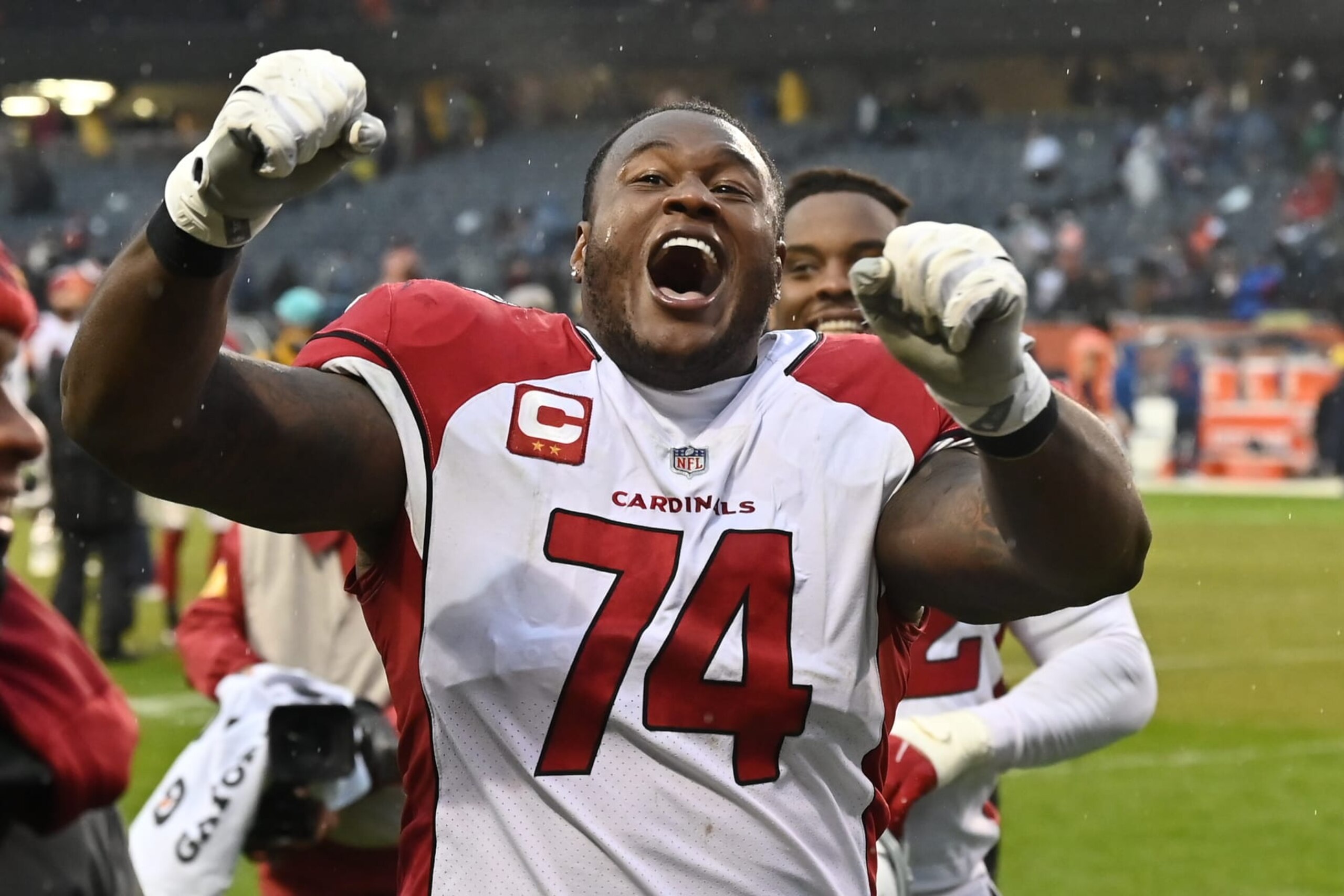 CHICAGO, ILLINOIS - DECEMBER 05:  D.J. Humphries #74 of the Arizona Cardinals celebrates with fans after Arizona defeated the Chicago Bears 33-22 at Soldier Field on December 05, 2021 in Chicago, Illinois.  (Photo by Jamie Sabau/Getty Images)