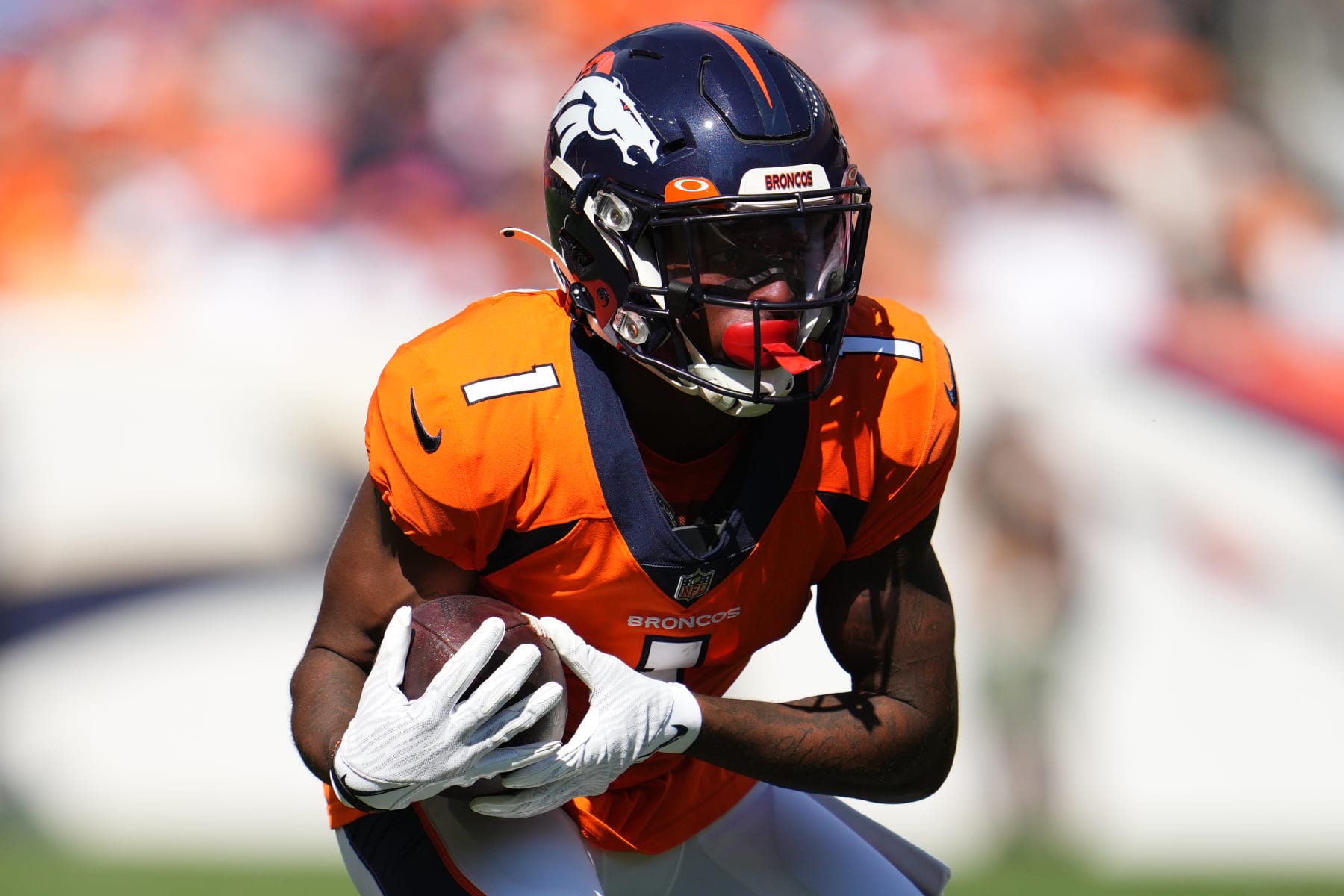 DENVER, COLORADO - SEPTEMBER 26: K.J. Hamler #1 of the Denver Broncos runs with the ball during an NFL game against the New York Jets at Empower Field At Mile High on September 26, 2021 in Denver, Colorado. (Photo by Cooper Neill/Getty Images)