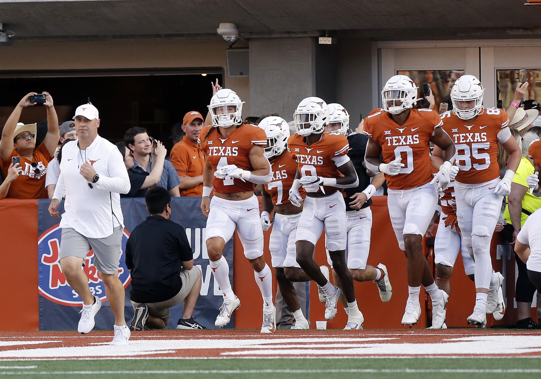 AUSTIN, TX - APRIL 23: University of Texas Longhorns Steve Sarkisian leads the team out on to the field during the spring game on April 23, 2022, at Darrell K Royal - Texas Memorial Stadium in Austin, TX. (Photo by Adam Davis/Icon Sportswire via Getty Images)