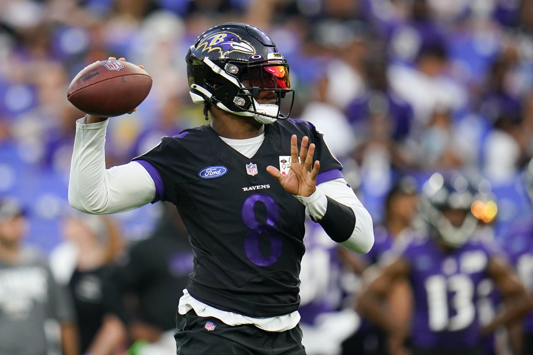 Baltimore Ravens quarterback Lamar Jackson works out during the team's NFL football training camp practice at M&T Stadium, Saturday, July 30, 2022, in Baltimore. (AP Photo/Julio Cortez)