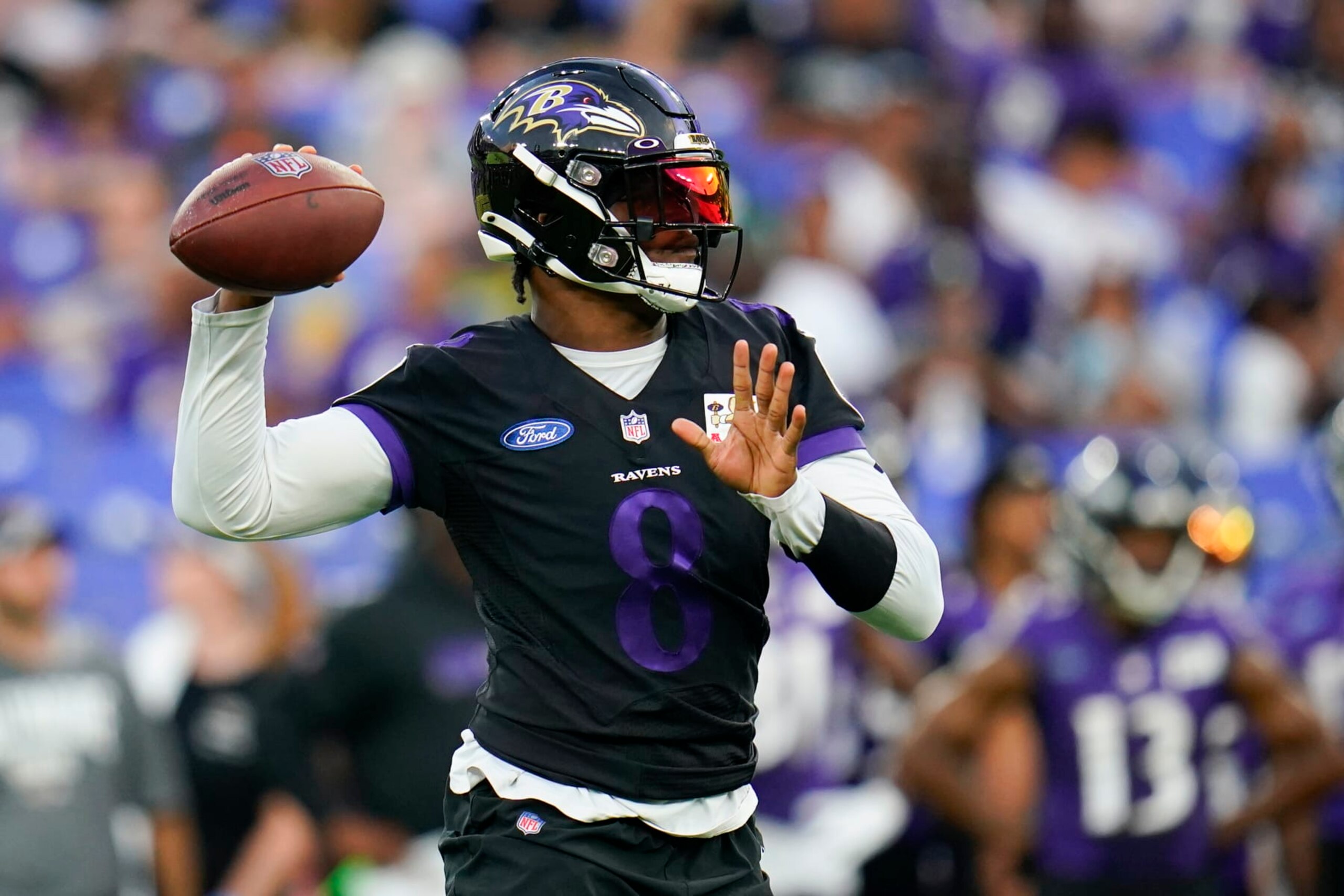 Baltimore Ravens quarterback Lamar Jackson works out during the team's NFL football training camp practice at M&T Stadium, Saturday, July 30, 2022, in Baltimore. (AP Photo/Julio Cortez)