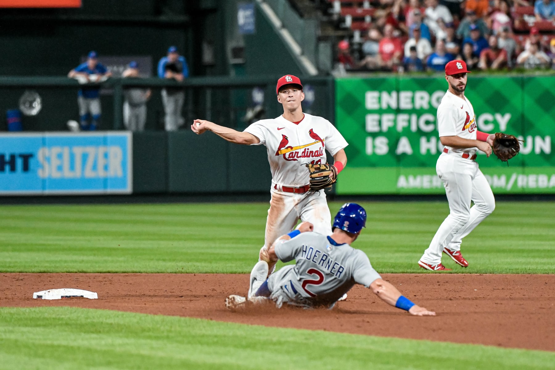 ST. LOUIS, MO - AUG 02: St. Louis Cardinals second baseman Tommy Edman (19) throws over Chicago Cubs shortstop Nico Hoerner (2) turning a double play during a game between the Chicago Cubs and the St. Louis Cardinals on Aug 02, 2022, at Busch Stadium in St. Louis MO (Photo by Rick Ulreich/Icon Sportswire via Getty Images)