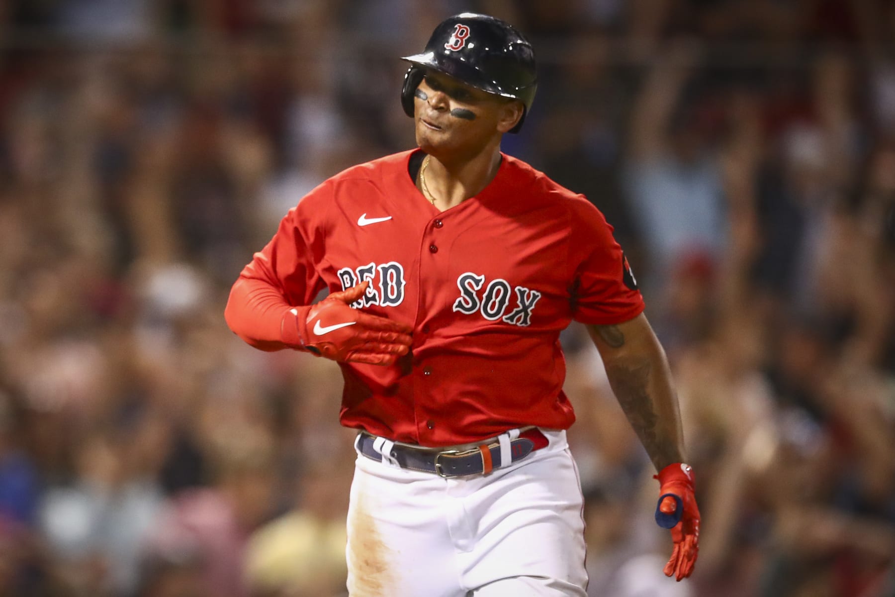 BOSTON, MA - JULY 07:  Rafael Devers #11 of the Boston Red Sox reacts as he tosses his bat after hitting a three-run home run in the fifth inning of a game against the New York Yankees at Fenway Park on July 7, 2022 in Boston, Massachusetts.  (Photo by Adam Glanzman/Getty Images)