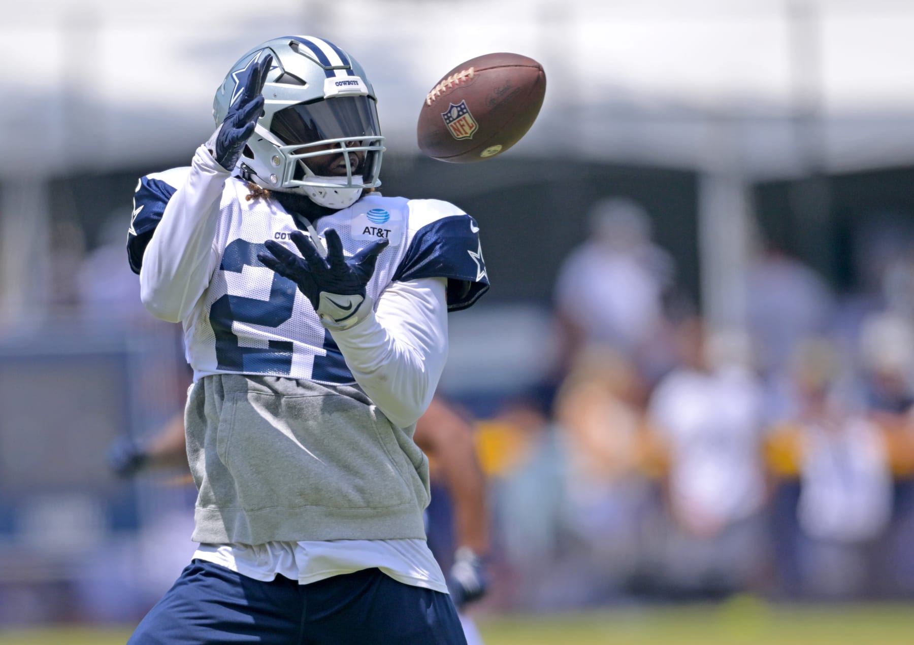 OXNARD, CA - AUGUST 01: Running back Ezekiel Elliott #21 of the Dallas Cowboys catches a pass during training camp drills at River Ridge Fields on August 1, 2022 in Oxnard, California. (Photo by Jayne Kamin-Oncea/Getty Images)
