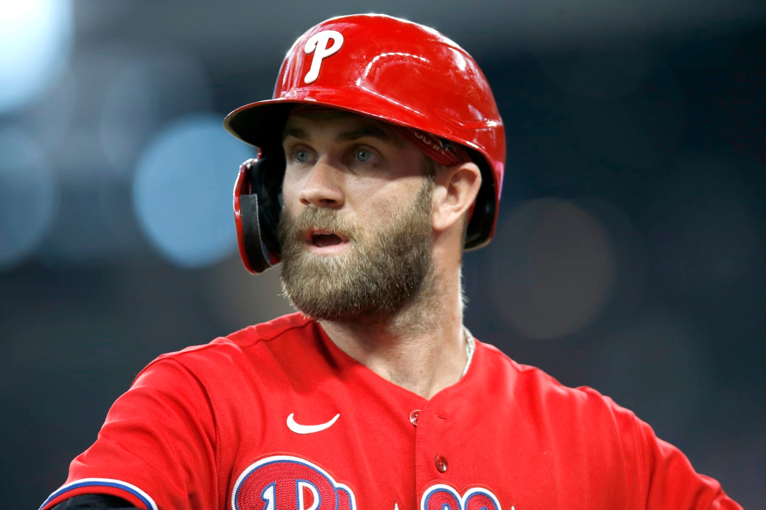 ARLINGTON, TEXAS - JUNE 22: Bryce Harper #3 of the Philadelphia Phillies walks off the field after the third out in the first inning against the Texas Rangers at Globe Life Field on June 22, 2022 in Arlington, Texas. (Photo by Tim Heitman/Getty Images)