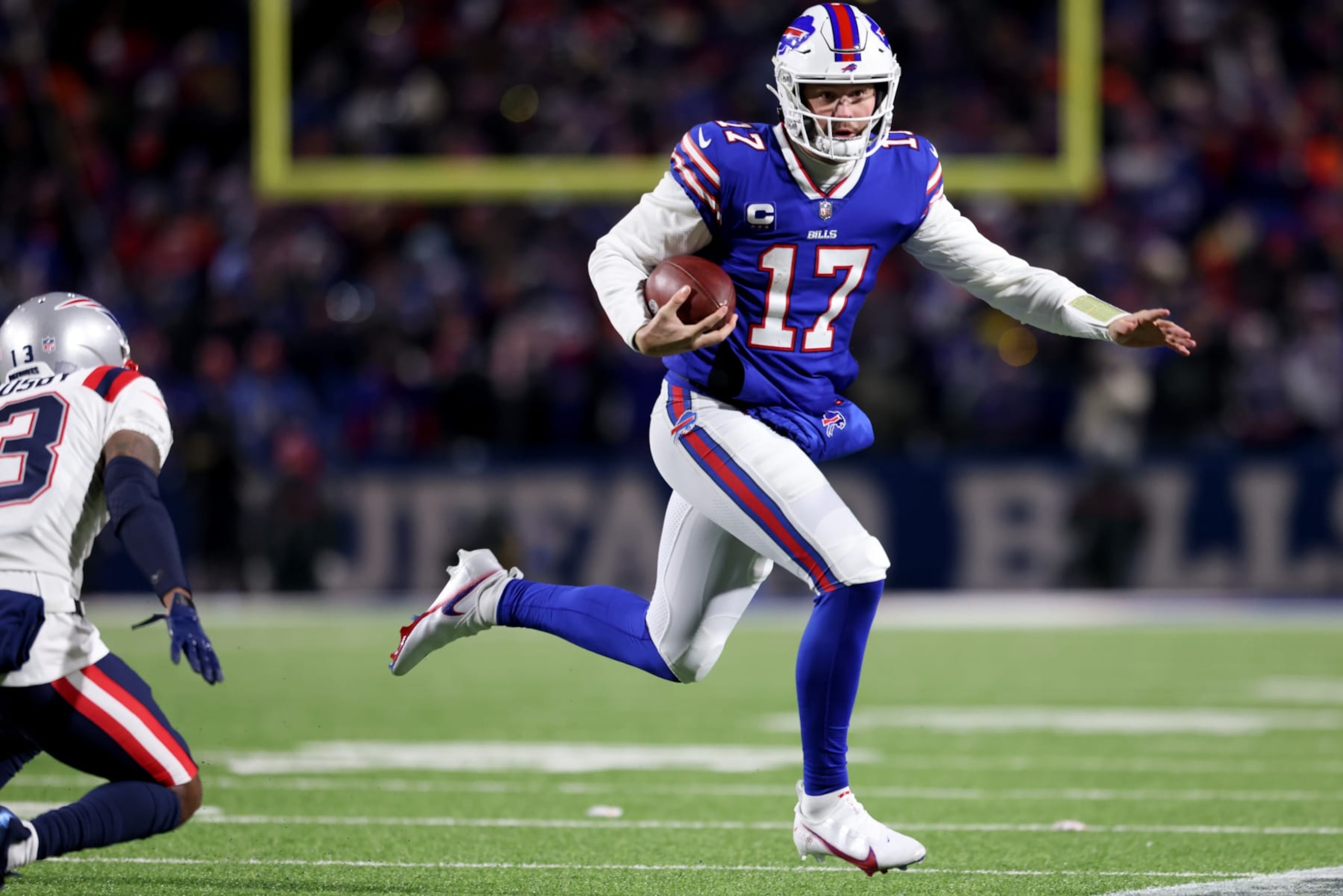 BUFFALO, NEW YORK - JANUARY 15: Josh Allen #17 of the Buffalo Bills runs the ball during the second quarter against the New England Patriots at Highmark Stadium on January 15, 2022 in Buffalo, New York. (Photo by Bryan M. Bennett/Getty Images)