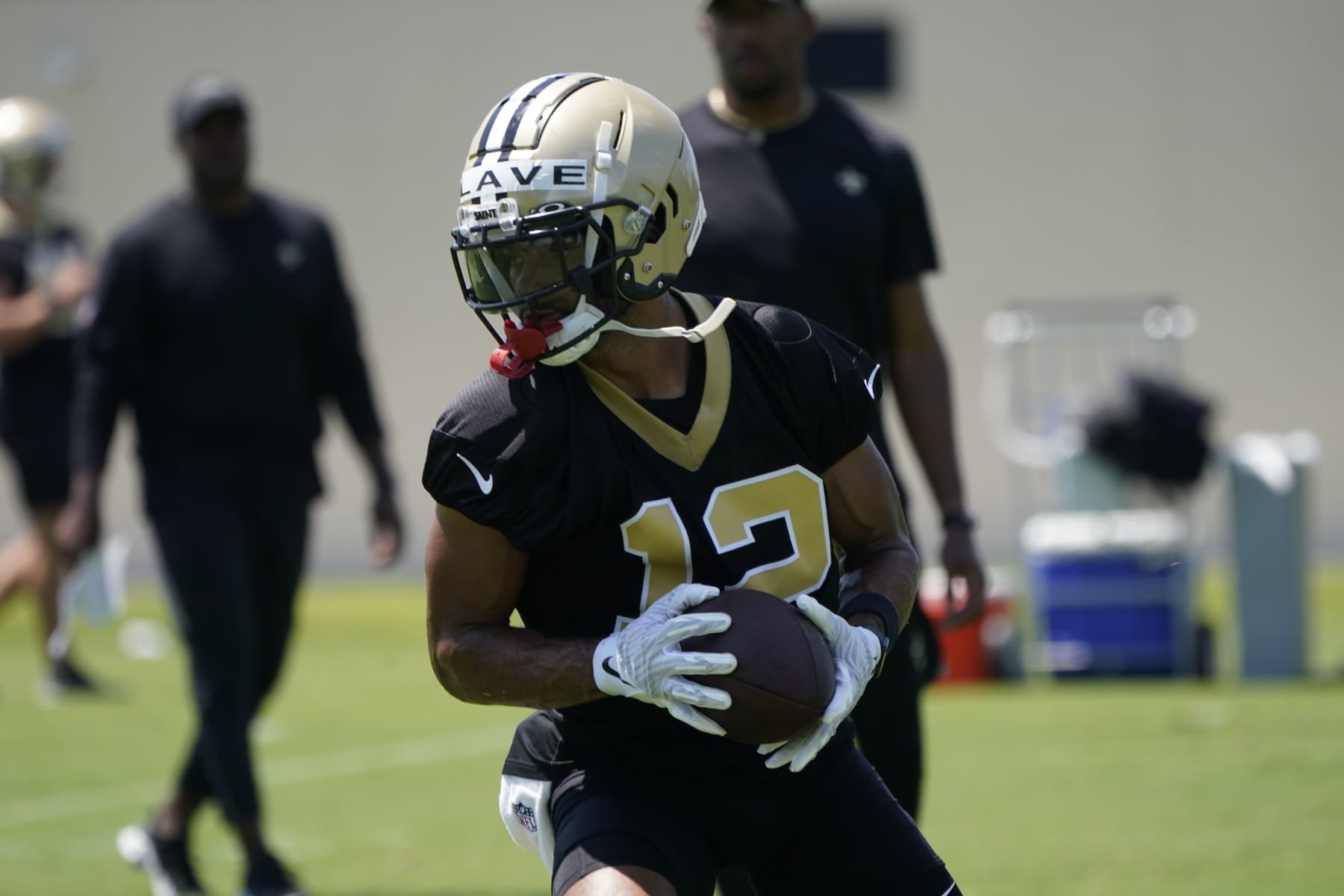 New Orleans Saints wide receiver Chris Olave (12) runs through drills during an NFL football practice in Metairie, La., Thursday, June 2, 2022. (AP Photo/Gerald Herbert)