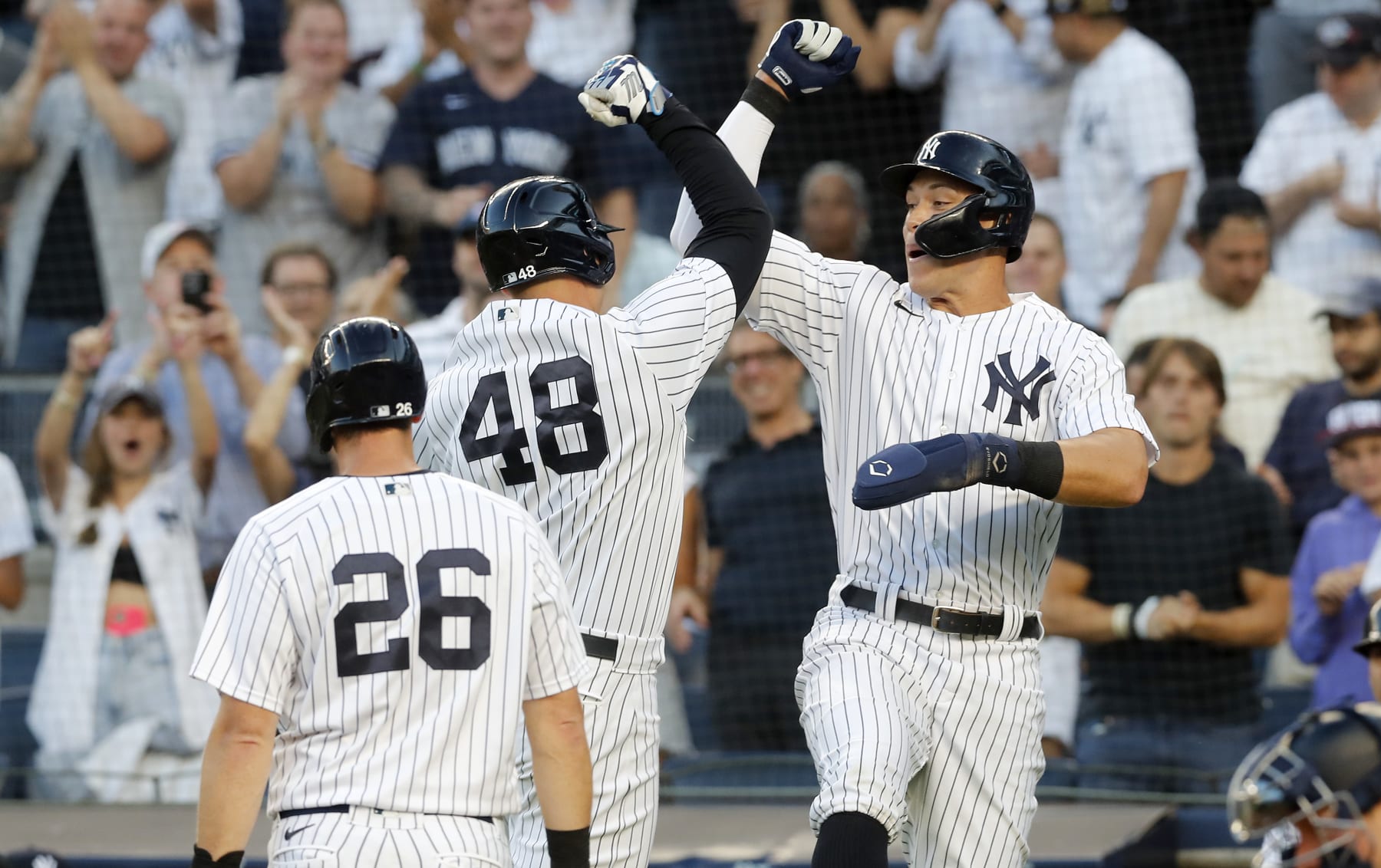 NEW YORK, NEW YORK - AUGUST 01:  Anthony Rizzo #48 of the New York Yankees celebrates his first inning three run home run against the Seattle Mariners with teammates Aaron Judge #99 and DJ LeMahieu #26 at Yankee Stadium on August 01, 2022 in New York City. (Photo by Jim McIsaac/Getty Images)
