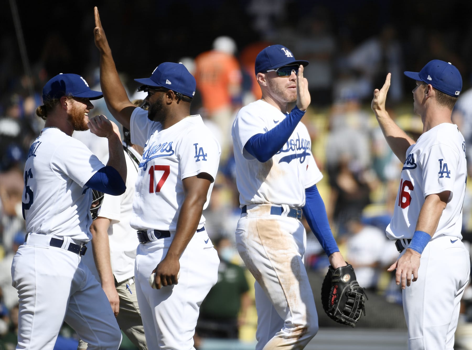 LOS ANGELES, CA - JULY 24:  (L-R) Craig Kimbrel #46, Hanser Alberto #17, Freddie Freeman #5 and Will Smith #16 of the Los Angeles Dodgers celebrate a 7-4 win over the San Francisco Giants at Dodger Stadium on July 24, 2022 in Los Angeles, California. (Photo by Kevork Djansezian/Getty Images)