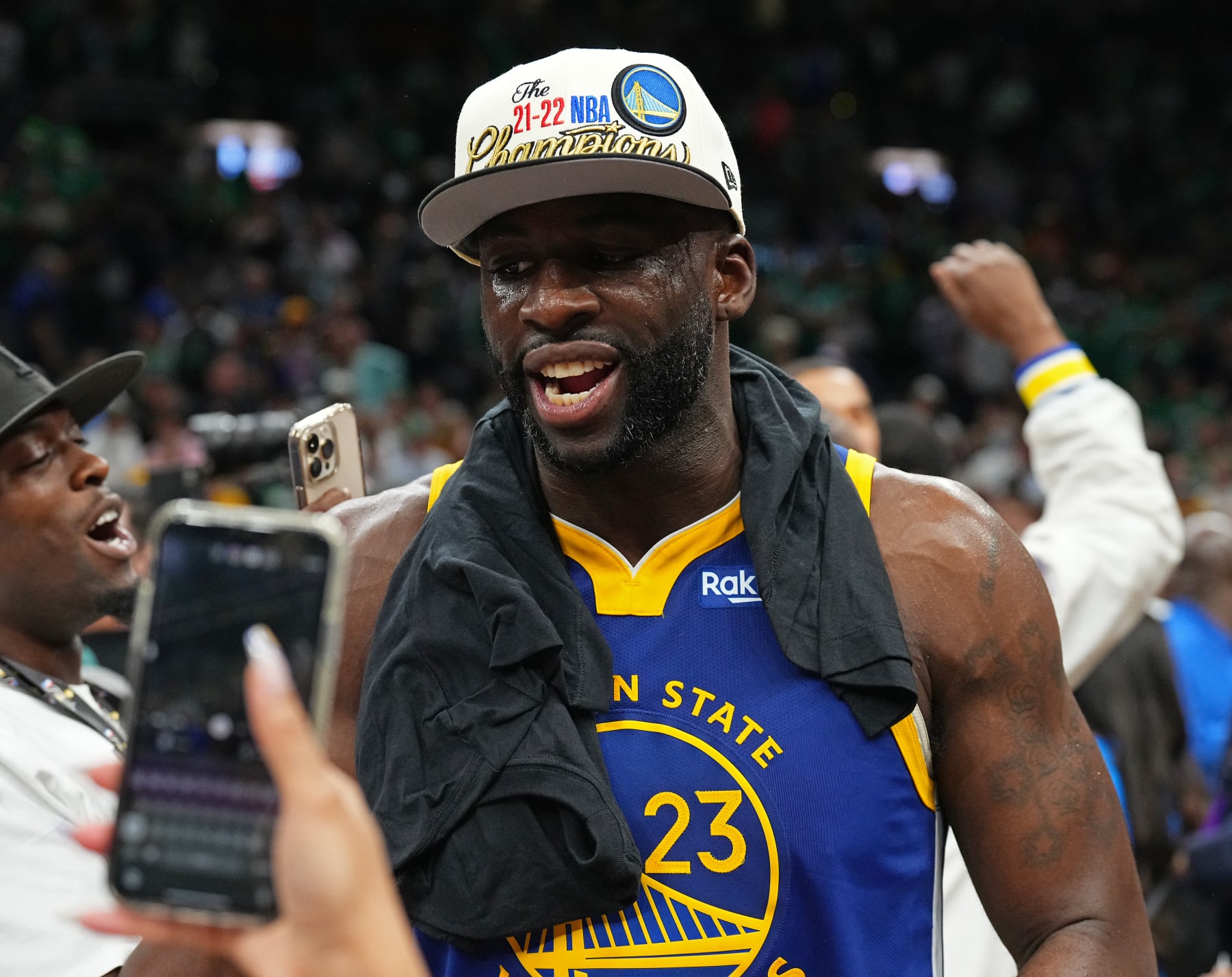 BOSTON, MA - JUNE 16: Draymond Green #23 of the Golden State Warriors smiles and celebrates on stage after winning Game Six of the 2022 NBA Finals against the Boston Celtics on June 16, 2022 at TD Garden in Boston, Massachusetts. NOTE TO USER: User expressly acknowledges and agrees that, by downloading and or using this photograph, user is consenting to the terms and conditions of Getty Images License Agreement. Mandatory Copyright Notice: Copyright 2022 NBAE (Photo by Garrett Ellwood/NBAE via Getty Images)