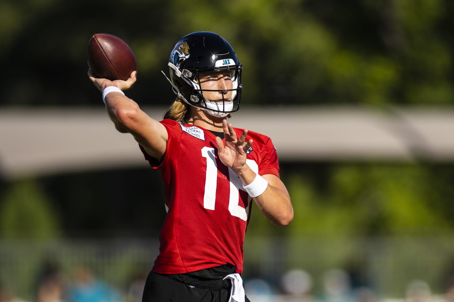 JACKSONVILLE, FLORIDA - JULY 27: Trevor Lawrence #16 of the Jacksonville Jaguars throws a pass during training camp on July 27, 2022 at Episcopal High School in Jacksonville, Florida. (Photo by James Gilbert/Getty Images)