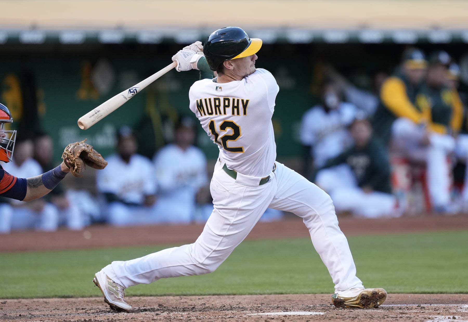 OAKLAND, CALIFORNIA - JULY 25: Sean Murphy #12 of the Oakland Athletics bats against the Houston Astros in the bottom of the fourth inning at RingCentral Coliseum on July 25, 2022 in Oakland, California. (Photo by Thearon W. Henderson/Getty Images)
