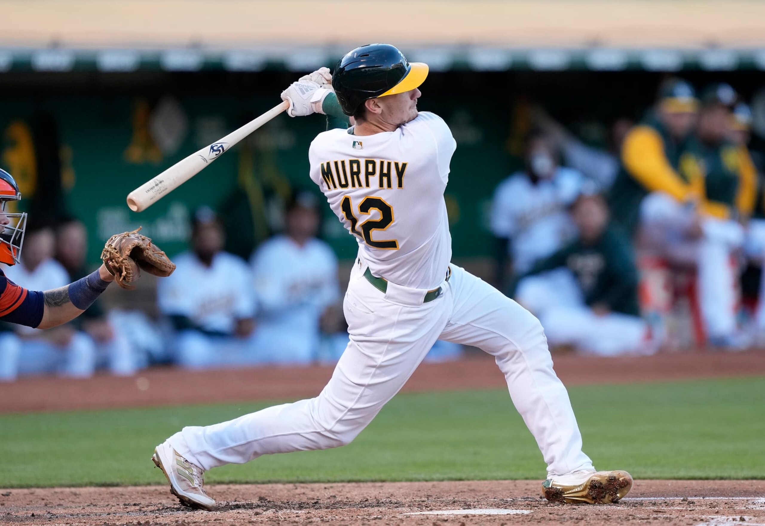 OAKLAND, CALIFORNIA - JULY 25: Sean Murphy #12 of the Oakland Athletics bats against the Houston Astros in the bottom of the fourth inning at RingCentral Coliseum on July 25, 2022 in Oakland, California. (Photo by Thearon W. Henderson/Getty Images)