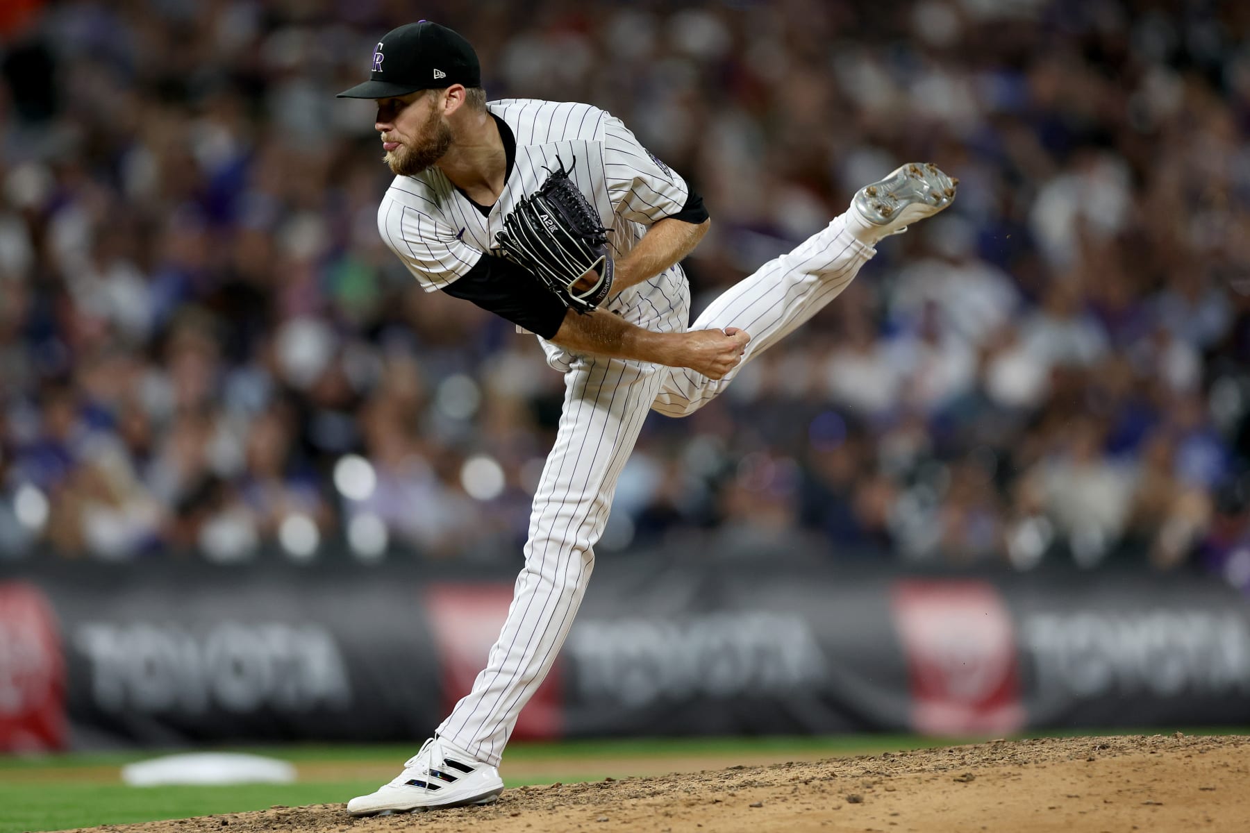 DENVER, COLORADO - JULY 30: Pitcher Daniel Bard #52 of the Colorado Rockies throws against the Los Angeles Dodgers in the ninth inning at Coors Field on July 30, 2022 in Denver, Colorado. (Photo by Matthew Stockman/Getty Images)