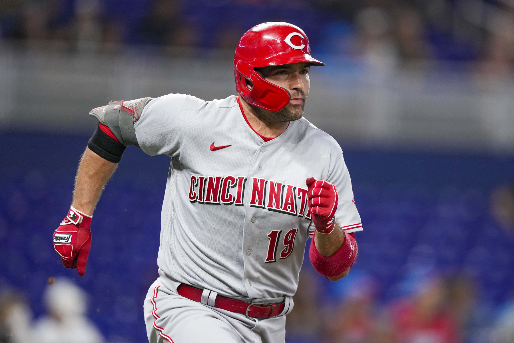 MIAMI, FLORIDA - AUGUST 01: Joey Votto #19 of the Cincinnati Reds singles in the second inning against the Miami Marlins at loanDepot park on August 01, 2022 in Miami, Florida. (Photo by Eric Espada/Getty Images)