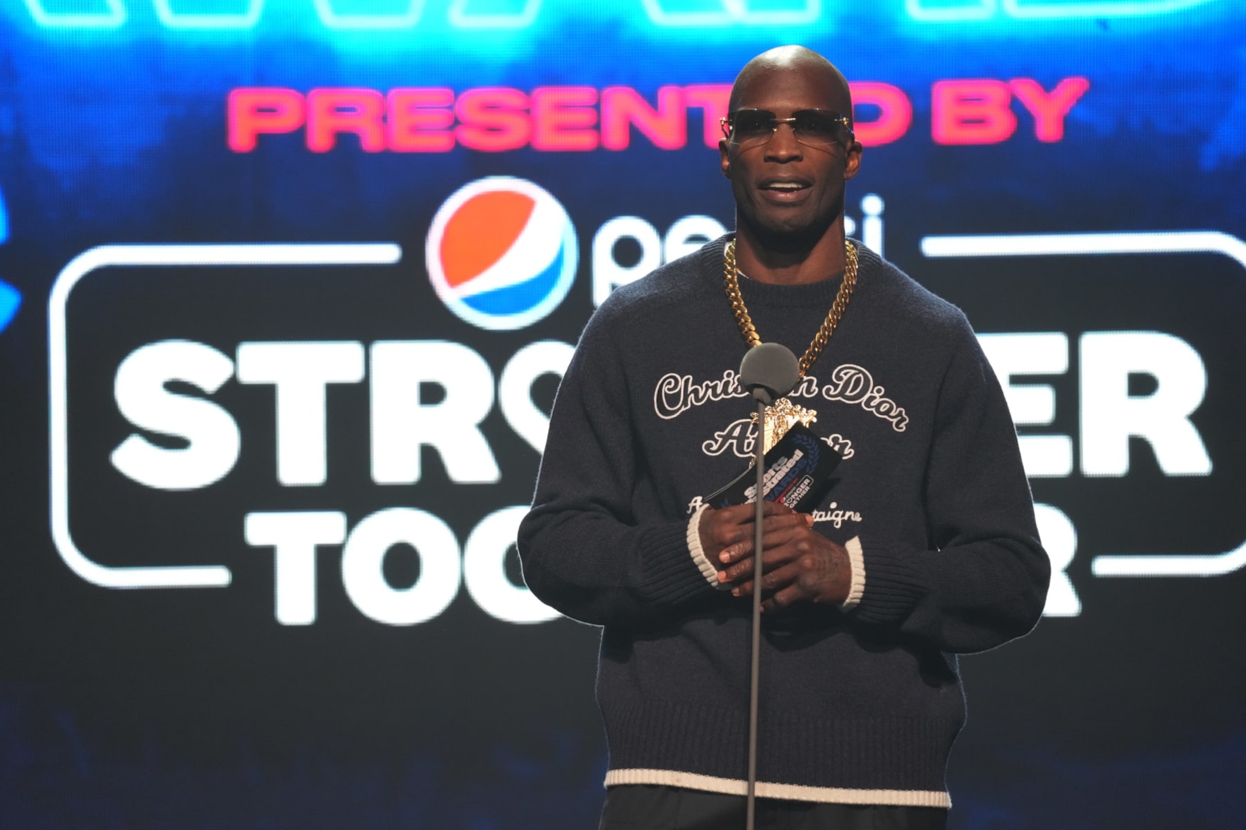 HOLLYWOOD, FLORIDA - DECEMBER 07: Chad "Ochocinco" Johnson presents the award for Gamer of the Year during The 2021 Sports Illustrated Awards at Seminole Hard Rock Hotel & Casino on December 07, 2021 in Hollywood, Florida. (Photo by Mark Brown/Getty Images)