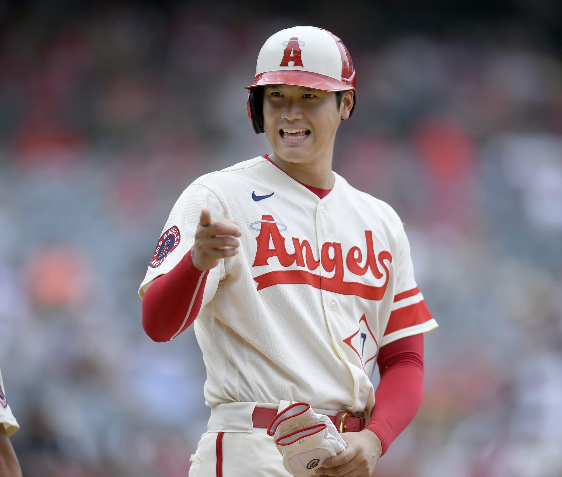 ANAHEIM, CA - AUGUST 04: Shohei Ohtani #17 of the Los Angeles Angels jokes with the Oakland Athletics dugout after he hit a single in the fifth inning at Angel Stadium of Anaheim on August 4, 2022 in Anaheim, California. (Photo by John McCoy/Getty Images)